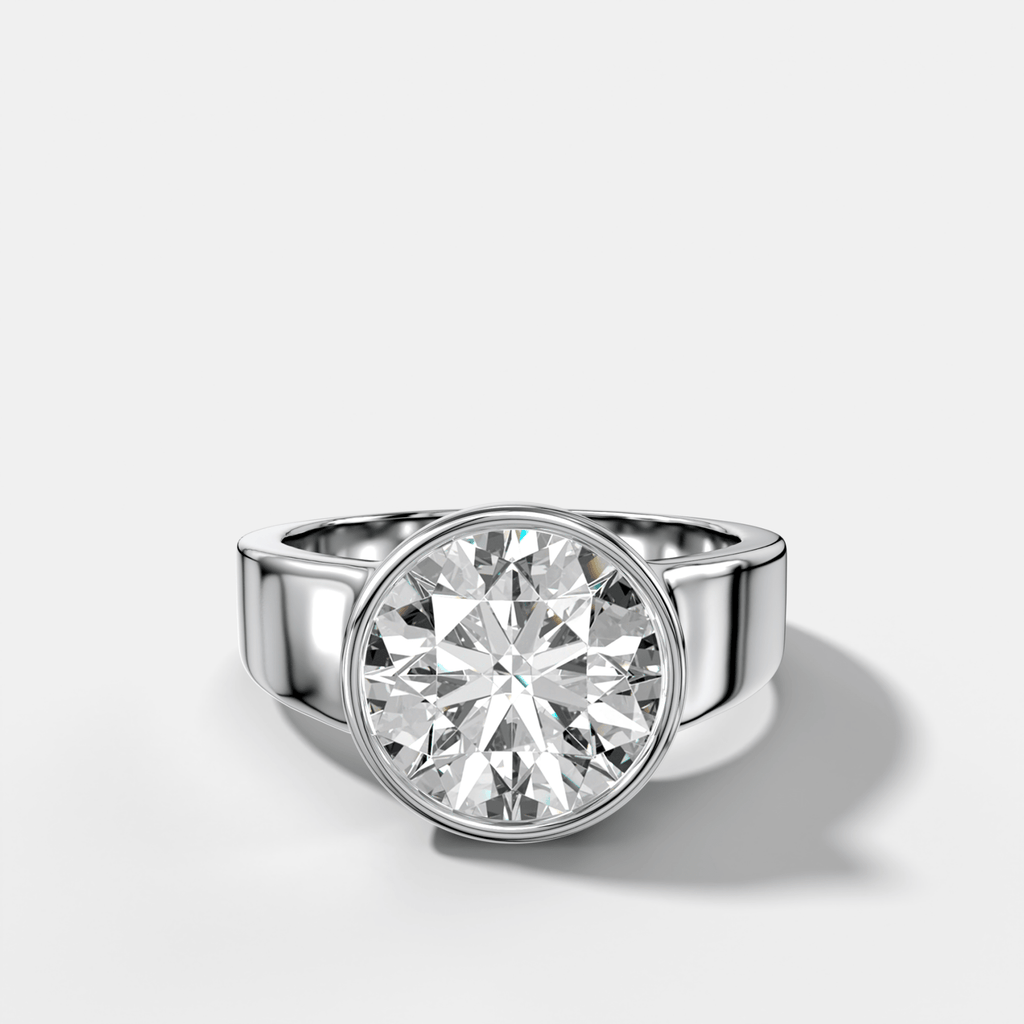 Finest Tapered Bezel Set Engagement Ring With Round Cut Diamond