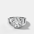 Finest Tapered Bezel Set Engagement Ring With Round Cut Diamond