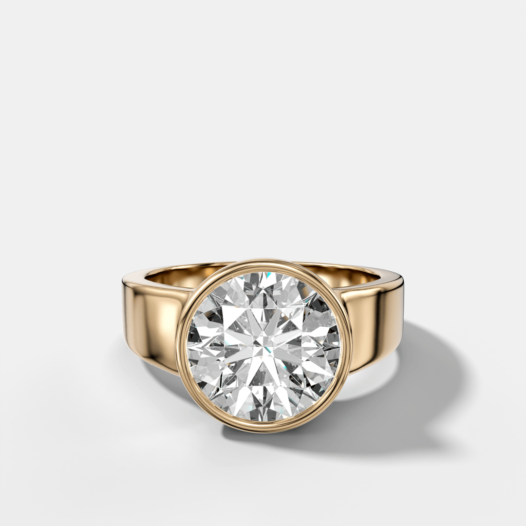 Finest Tapered Bezel Set Engagement Ring With Round Cut Diamond