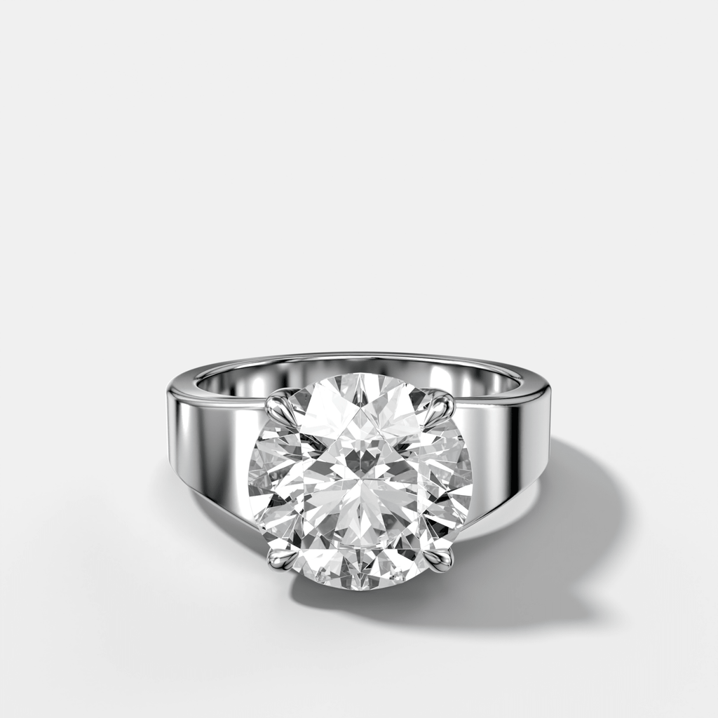 Finest Tapered Engagement Ring With Round Cut Diamond
