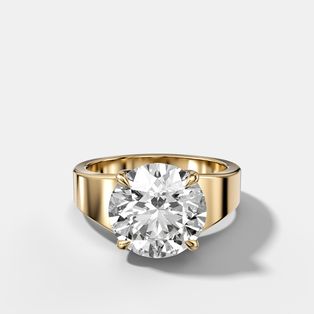 Finest Tapered Engagement Ring With Round Cut Diamond