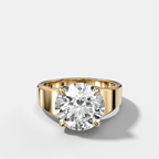 Finest Tapered Engagement Ring With Round Cut Diamond