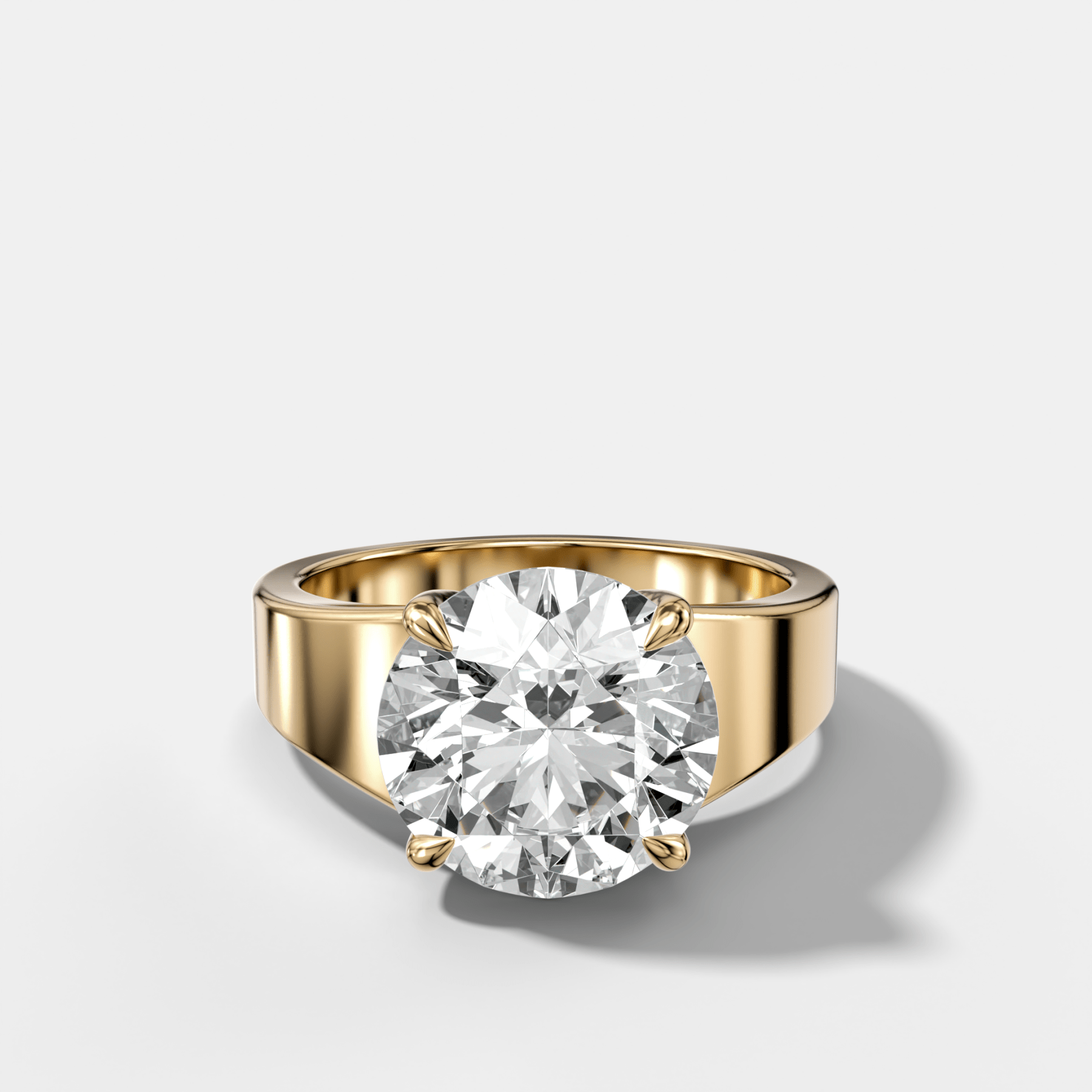 Finest Tapered Engagement Ring With Round Cut Diamond