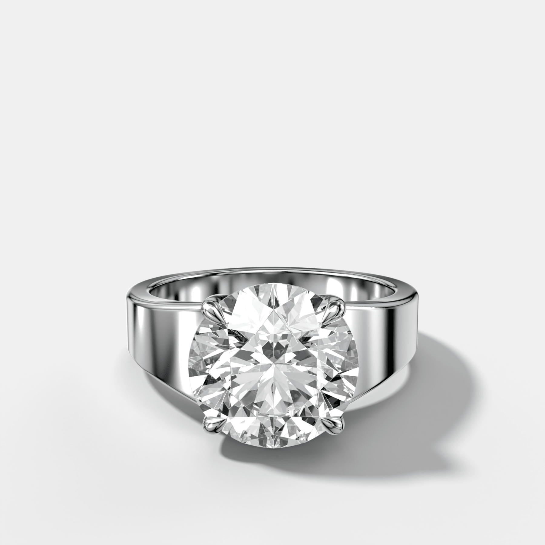 Finest Tapered Engagement Ring With Round Cut Diamond