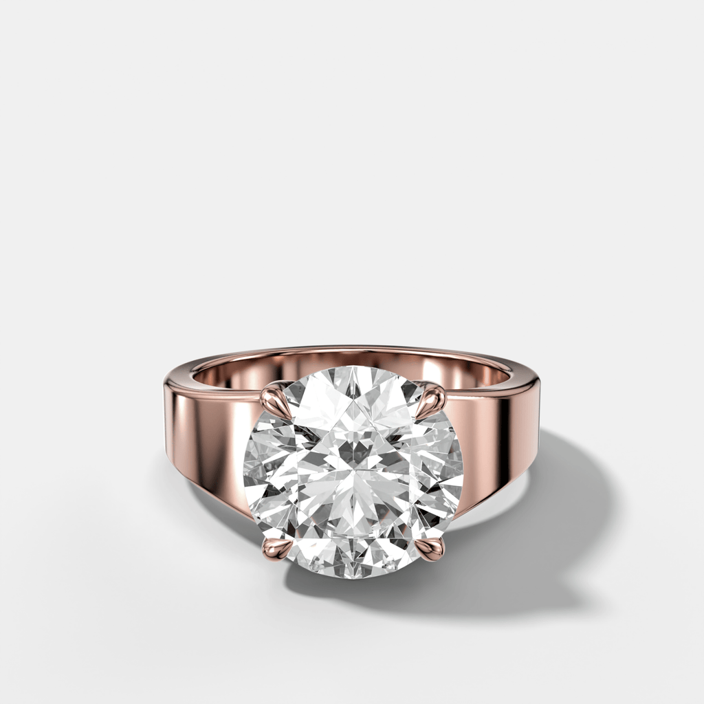 Finest Tapered Engagement Ring With Round Cut Diamond