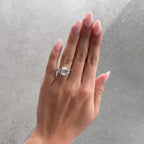 Five Stone Engagement Ring with Half Bezel Baguette Side Stones and Bezel Set Emerald Cut Diamond