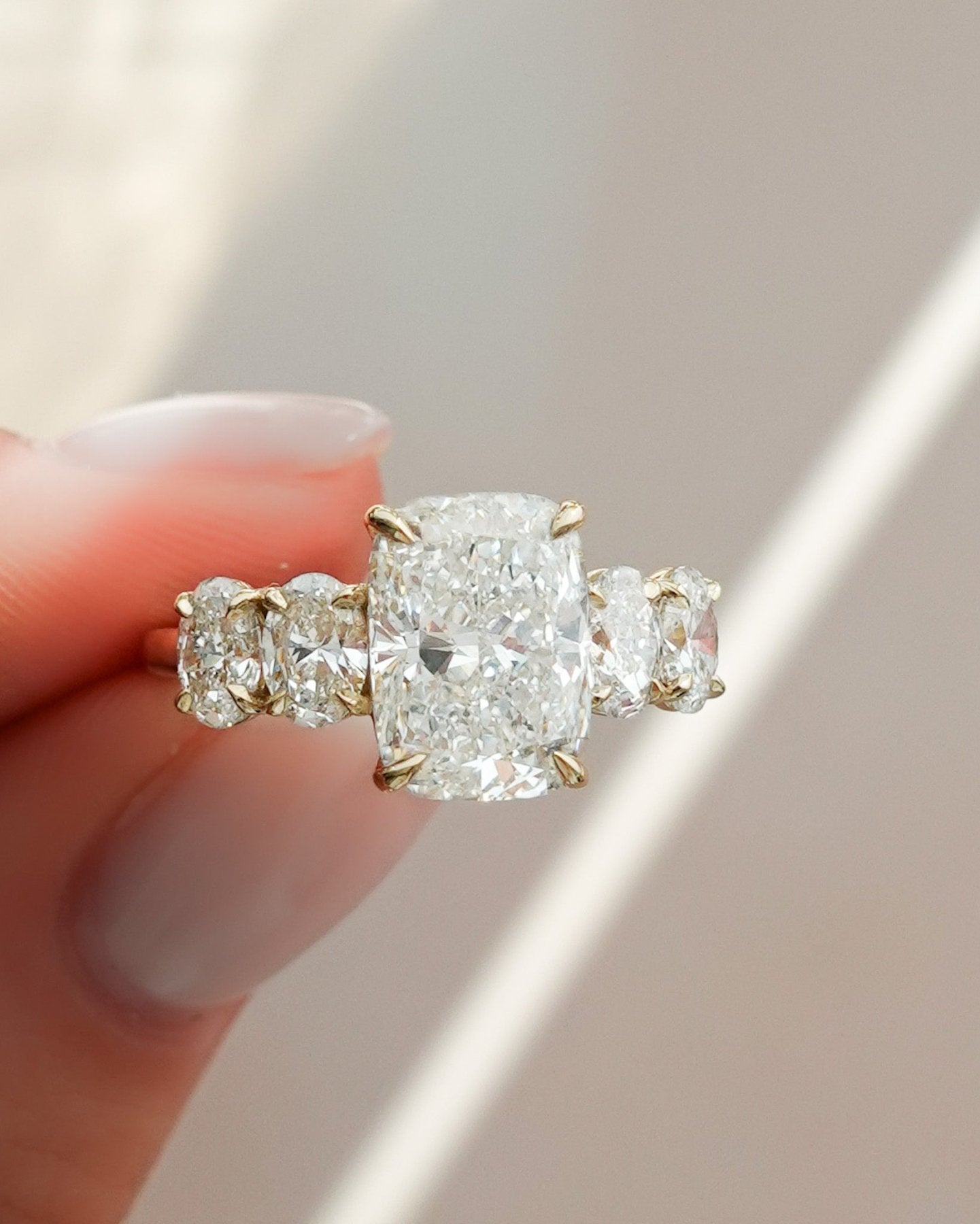 Five Stone Oval Engagement Ring With Elongated Cushion Cut Diamond