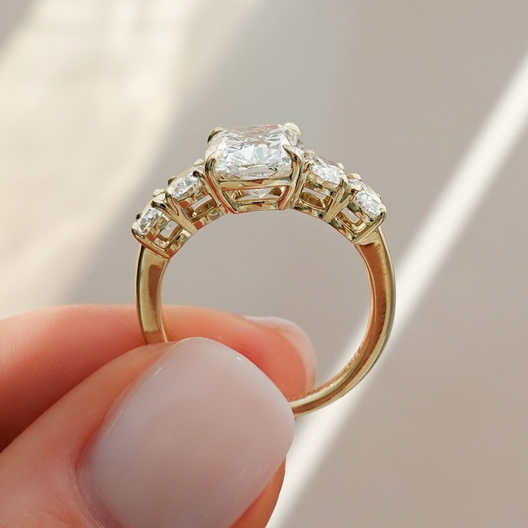 Five Stone Oval Engagement Ring With Elongated Cushion Cut Diamond
