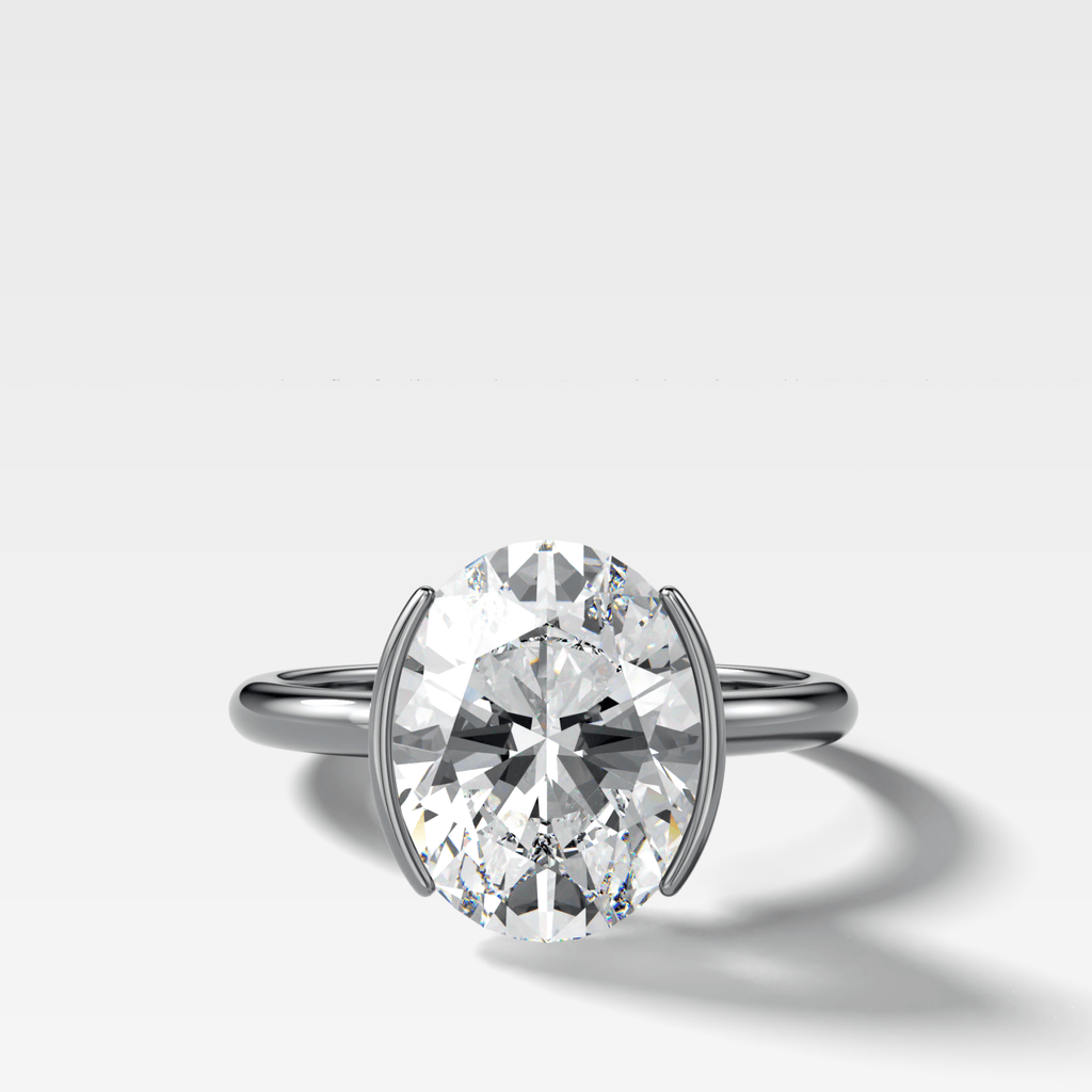 Half Bezel Solitaire Engagement Ring With Oval Cut Diamond