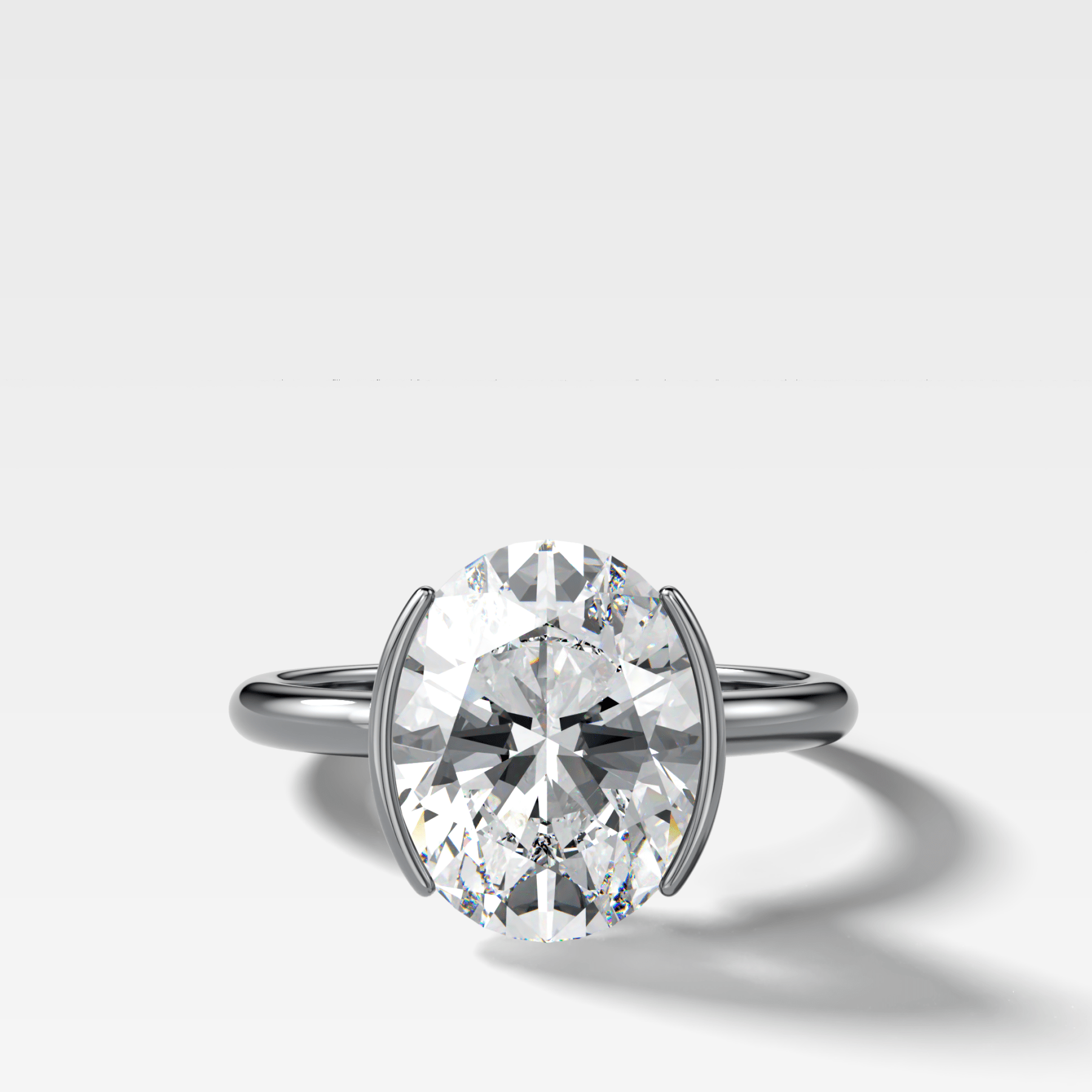 Half Bezel Solitaire Engagement Ring With Oval Cut Diamond