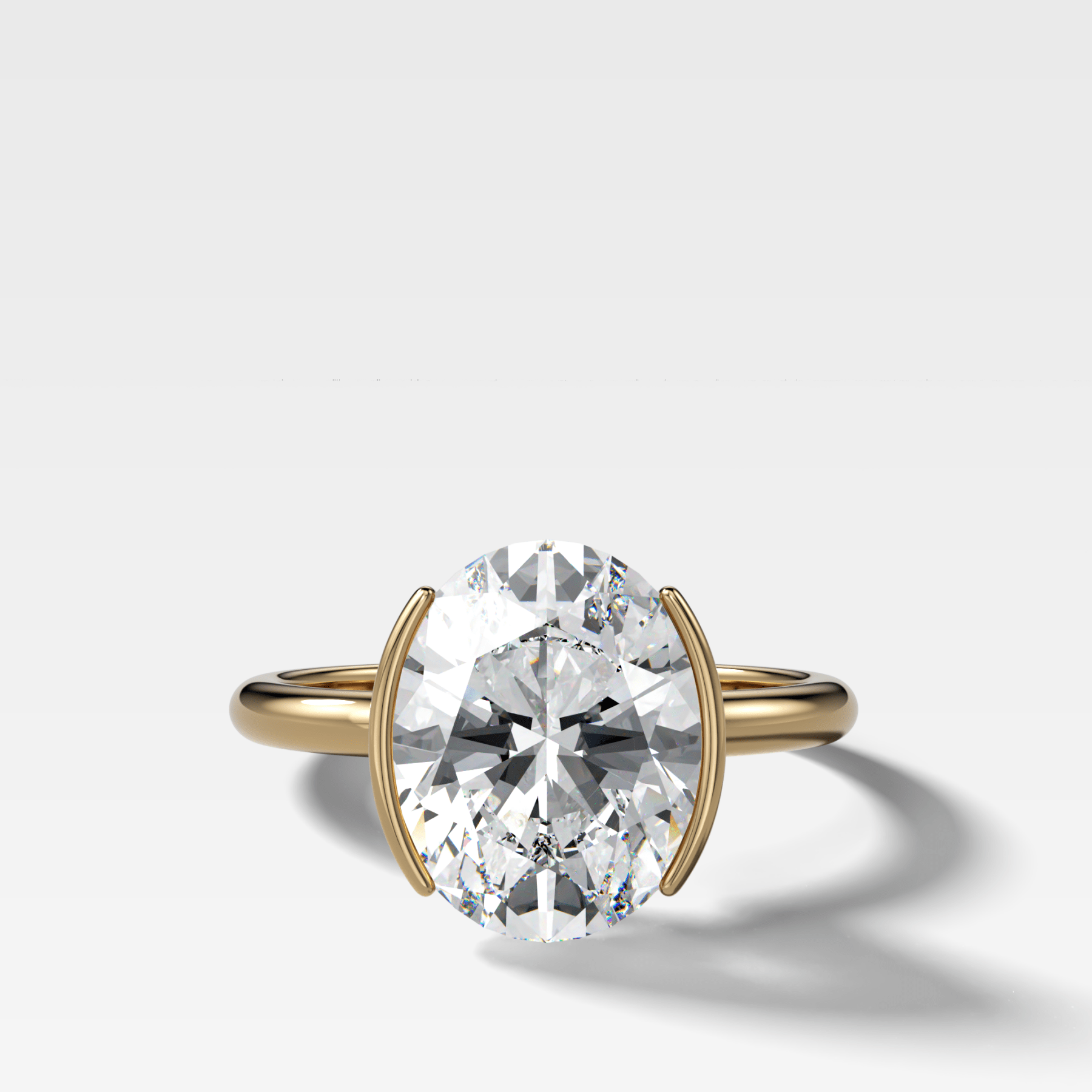 Half Bezel Solitaire Engagement Ring With Oval Cut Diamond