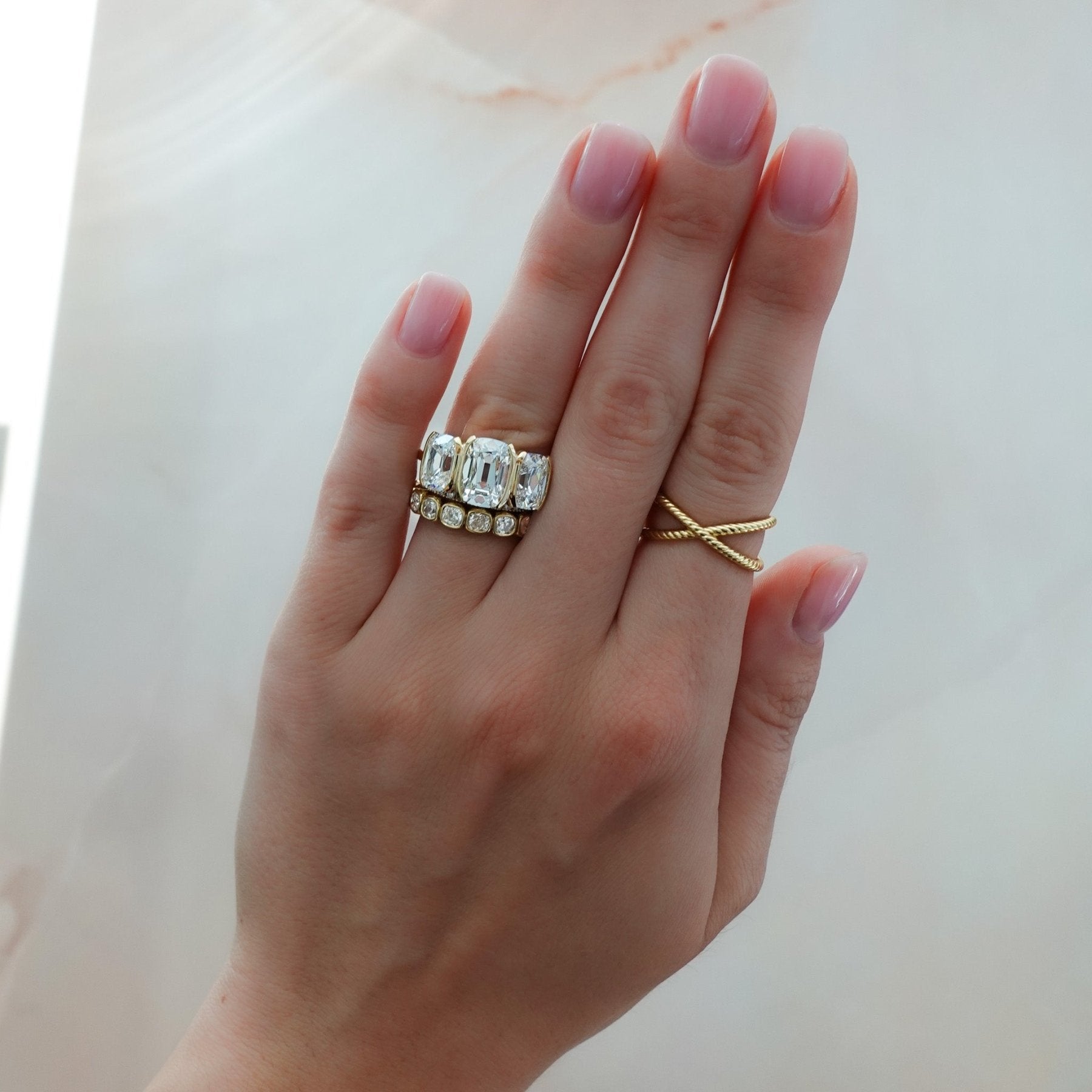 Half Bezel Triad Engagement Ring With Elongated Old Mine Cut Diamonds