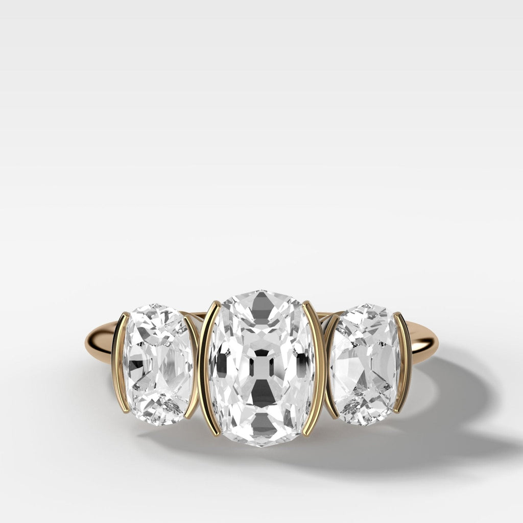 Half Bezel Triad Engagement Ring With Elongated Old Mine Cut Diamonds