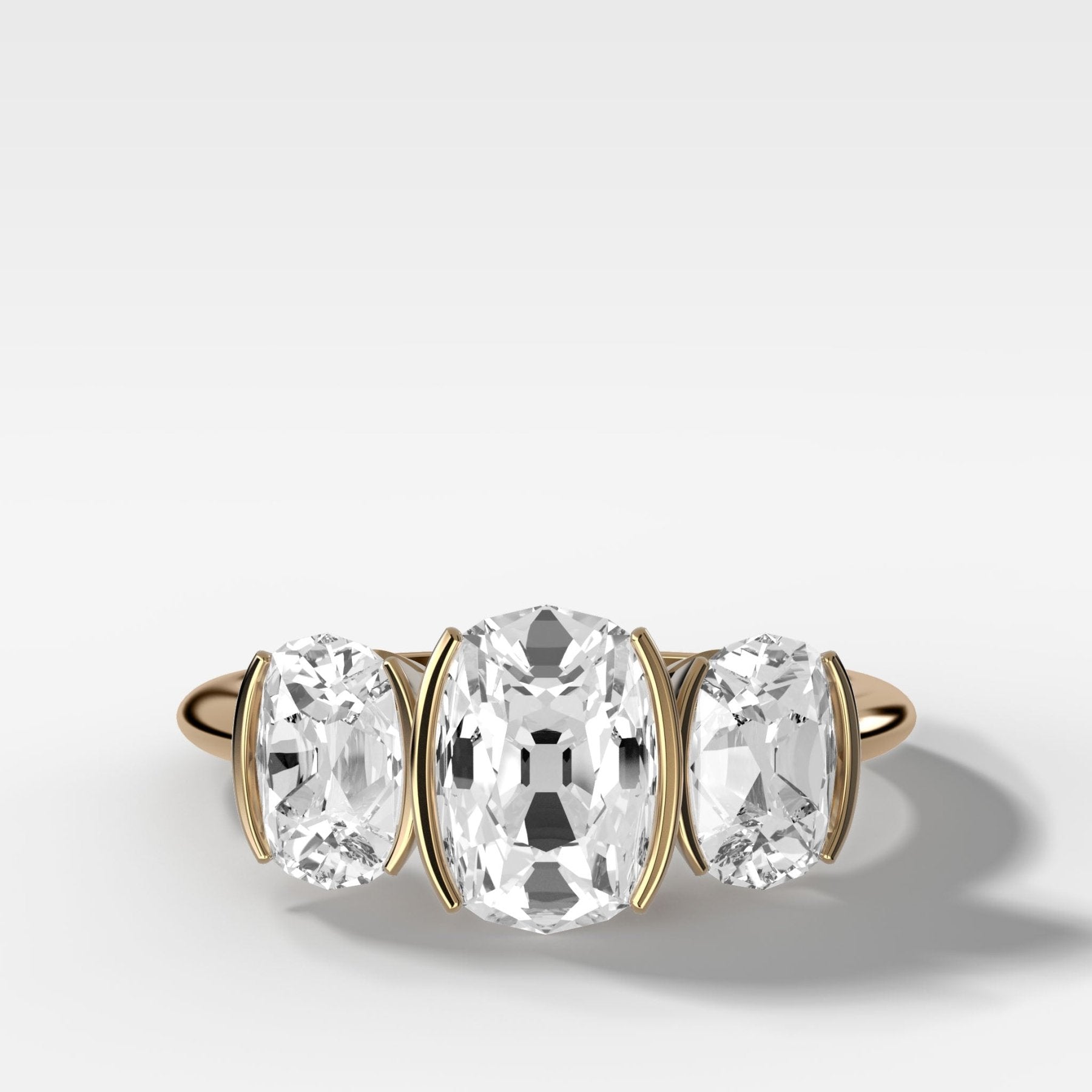 Half Bezel Triad Engagement Ring With Elongated Old Mine Cut Diamonds