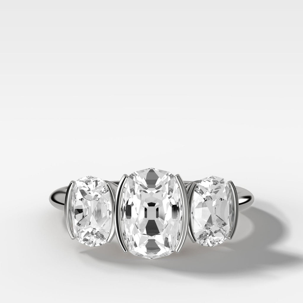 Half Bezel Triad Engagement Ring With Elongated Old Mine Cut Diamonds