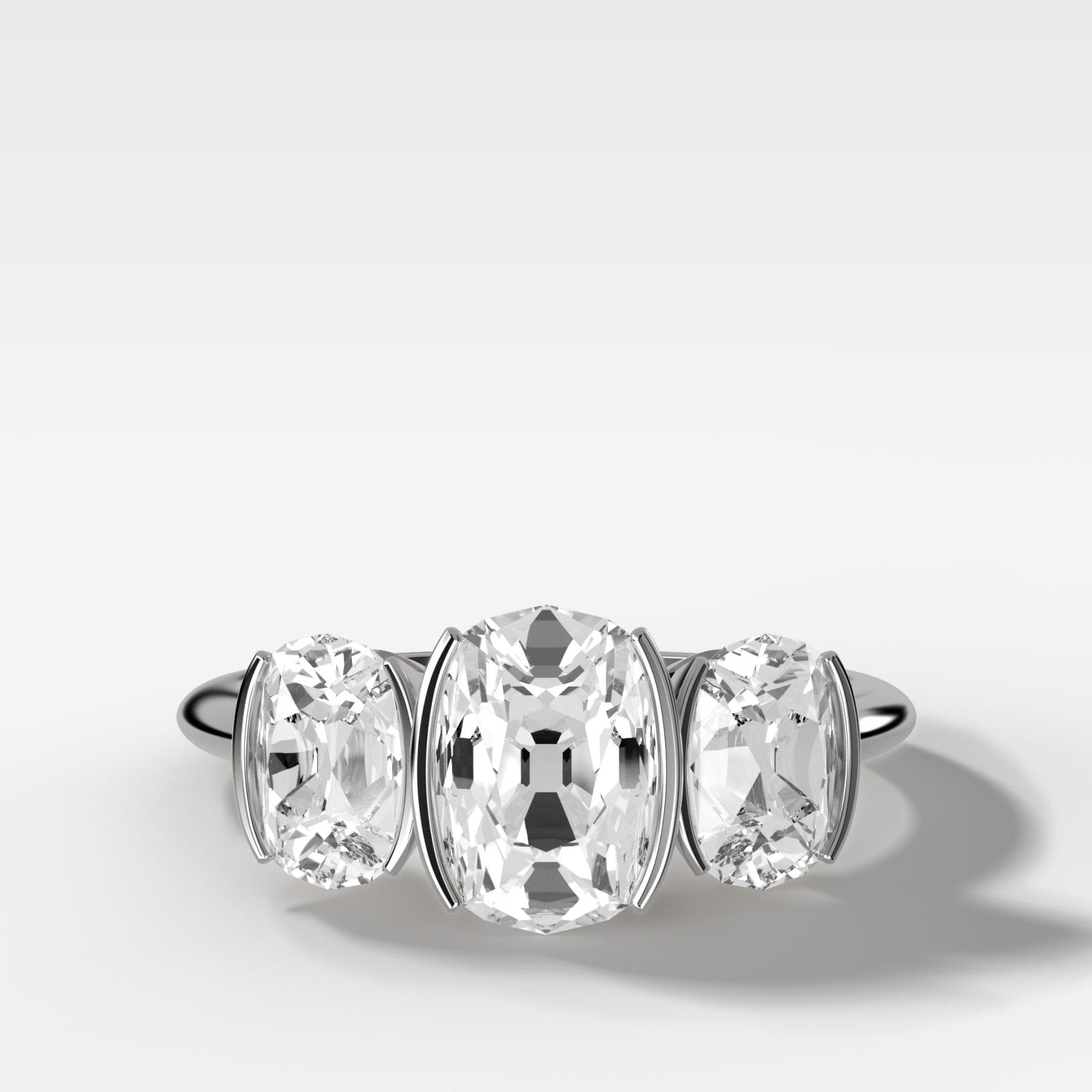 Half Bezel Triad Engagement Ring With Elongated Old Mine Cut Diamonds