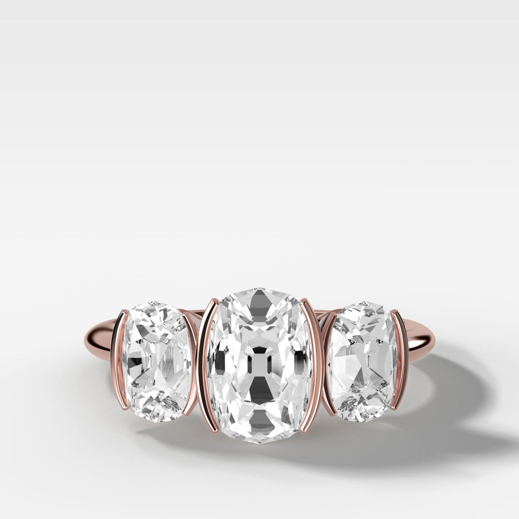 Half Bezel Triad Engagement Ring With Elongated Old Mine Cut Diamonds