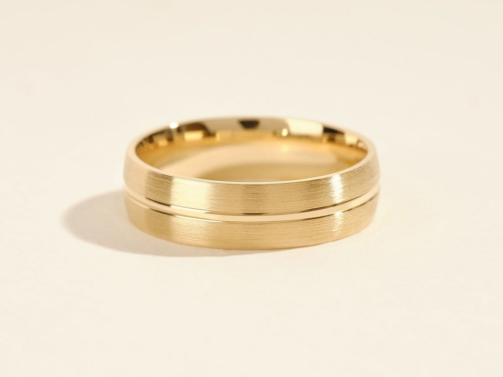 Man's Wedding Band With A Matte Finish and a Polished Groove Around The Center.