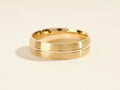 Man's Wedding Band With A Matte Finish and a Polished Groove Around The Center.