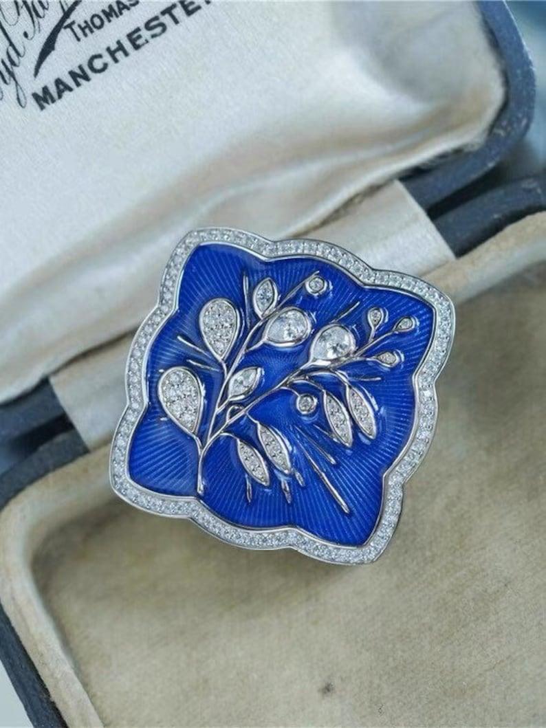 Blue enamel with moissanite diamond brooch