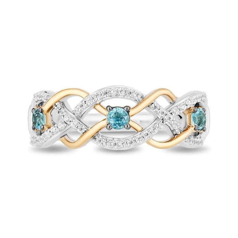 Enchanted Disney Brave 10th Anniversary Simulated Blue Topaz and Diamond Twist Ring