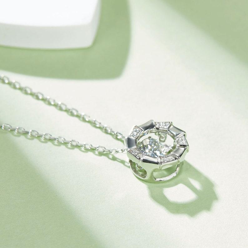 Celestial Embrace: 5mm Round 0.5ct Moissanite Halo Pendant