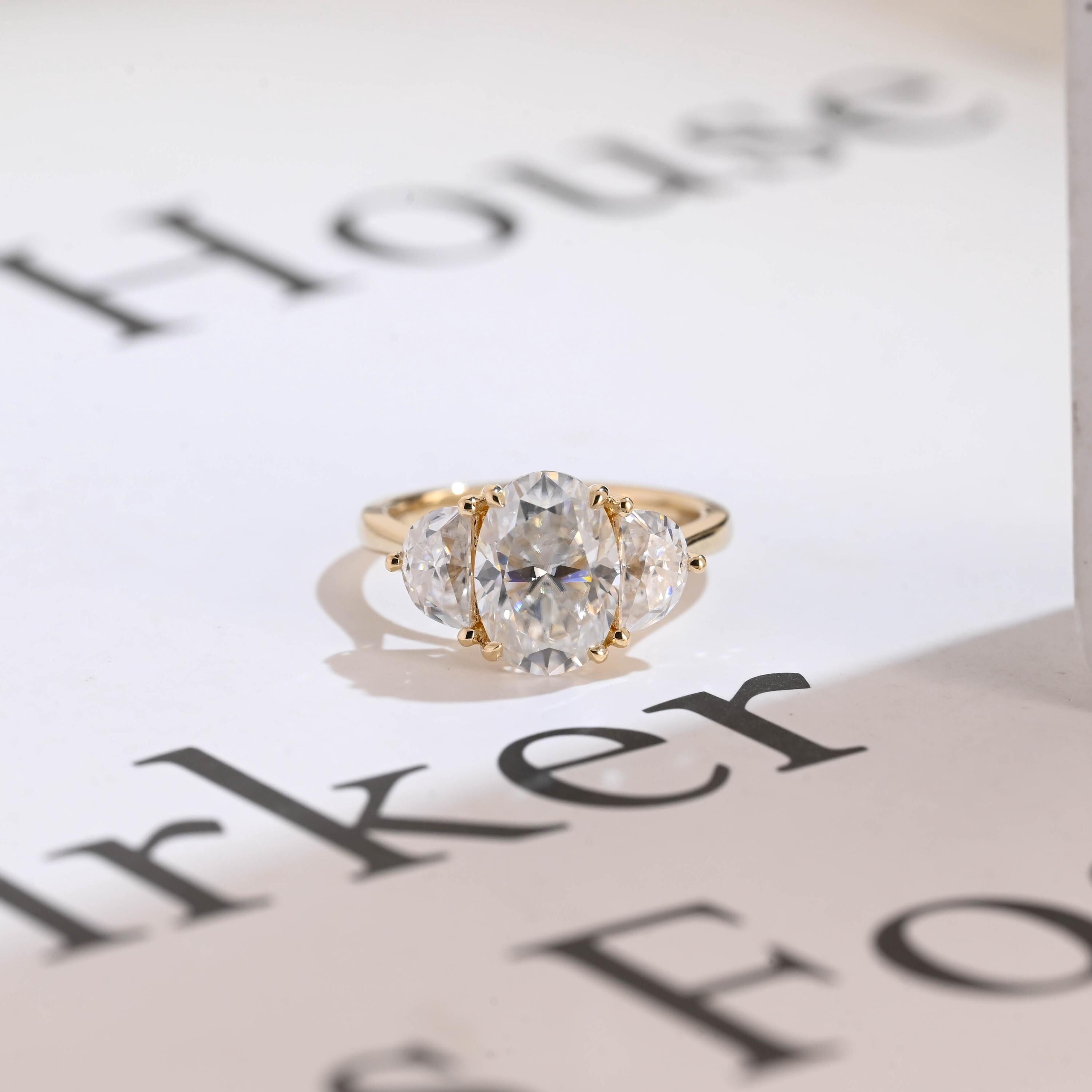 Solid Gold Oval Moissanite Engagement Ring with Half-moon Side Stones Main image