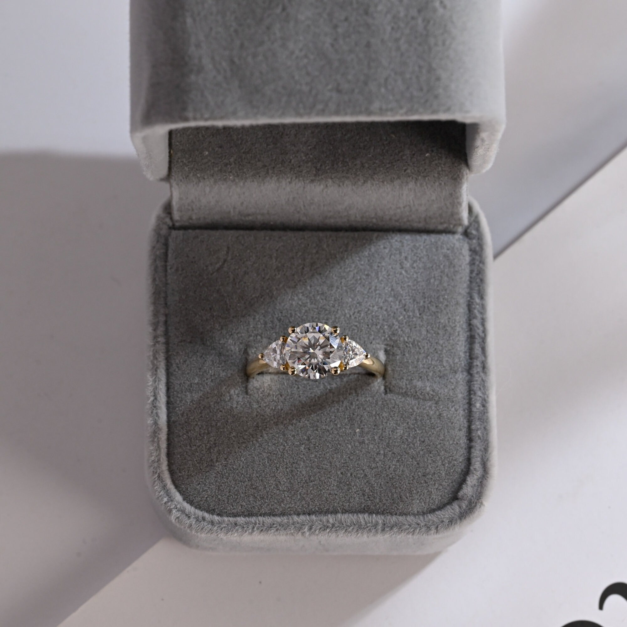Solid Gold Three Stone Round Cut Moissanite Engagement Ring with Trillion Accent
