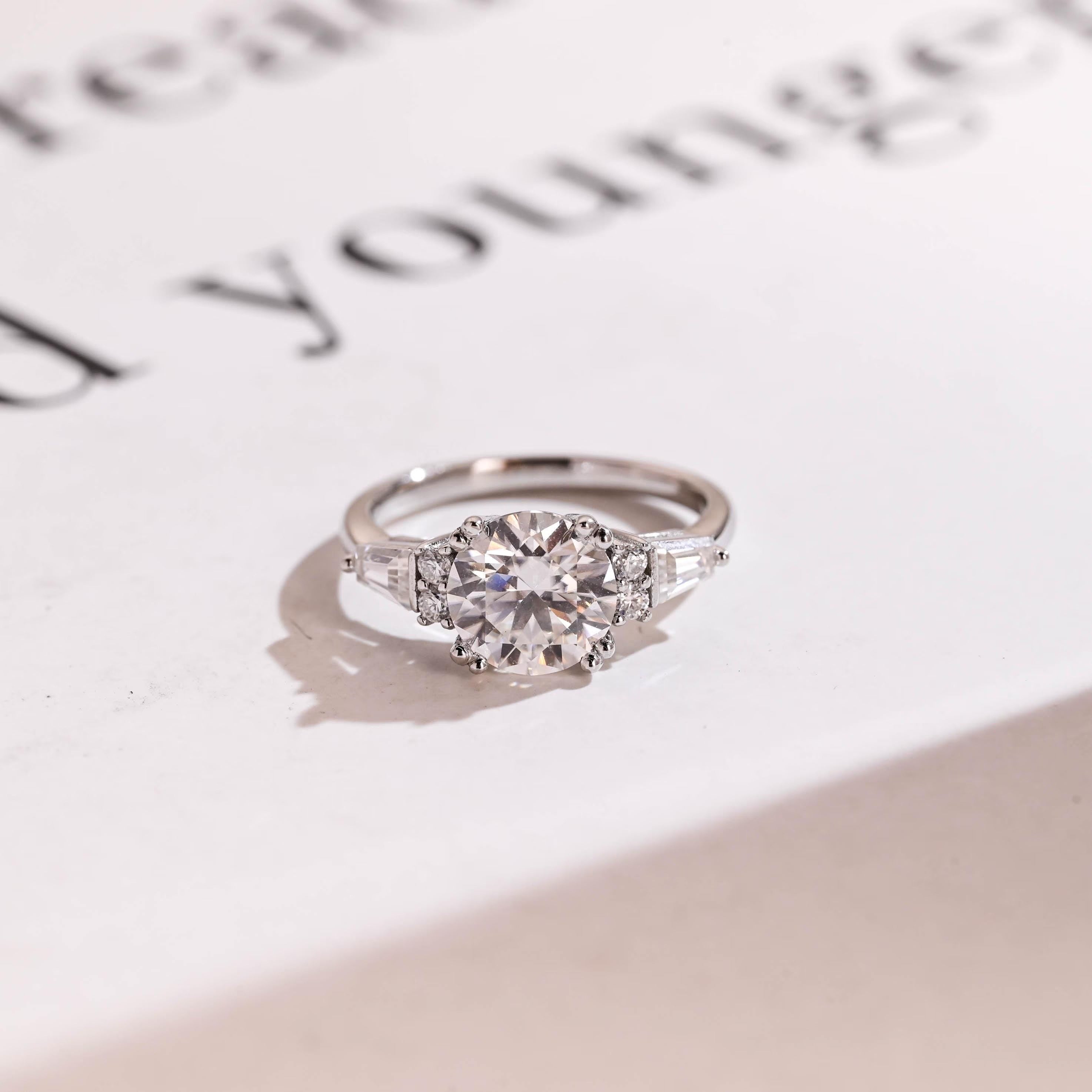Solid Gold Round Cut Moissanite Engagement Ring with Trapezoid Accent Main image