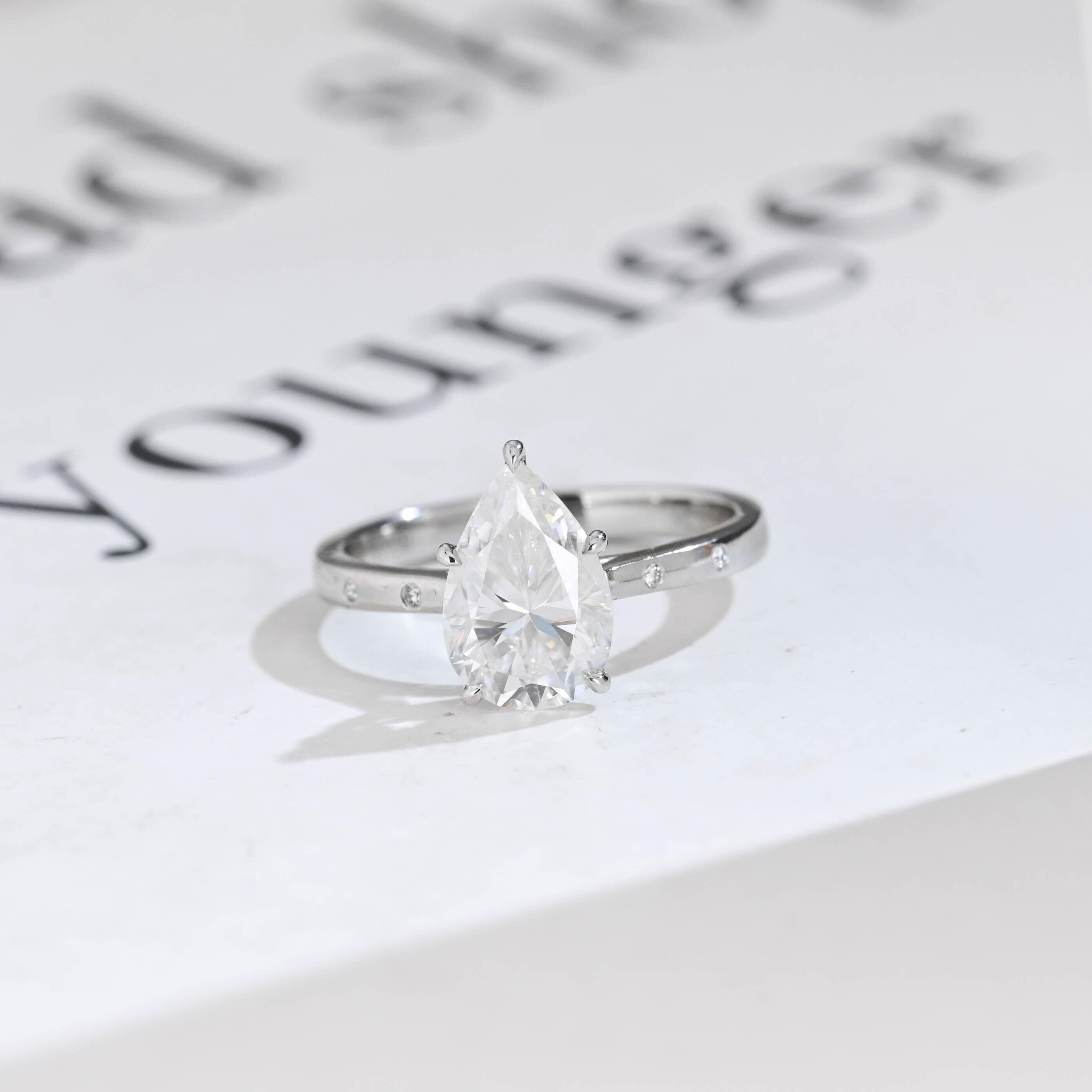 Solid Gold Pear Moissanite Engagement Ring with Hidden Halo Main image