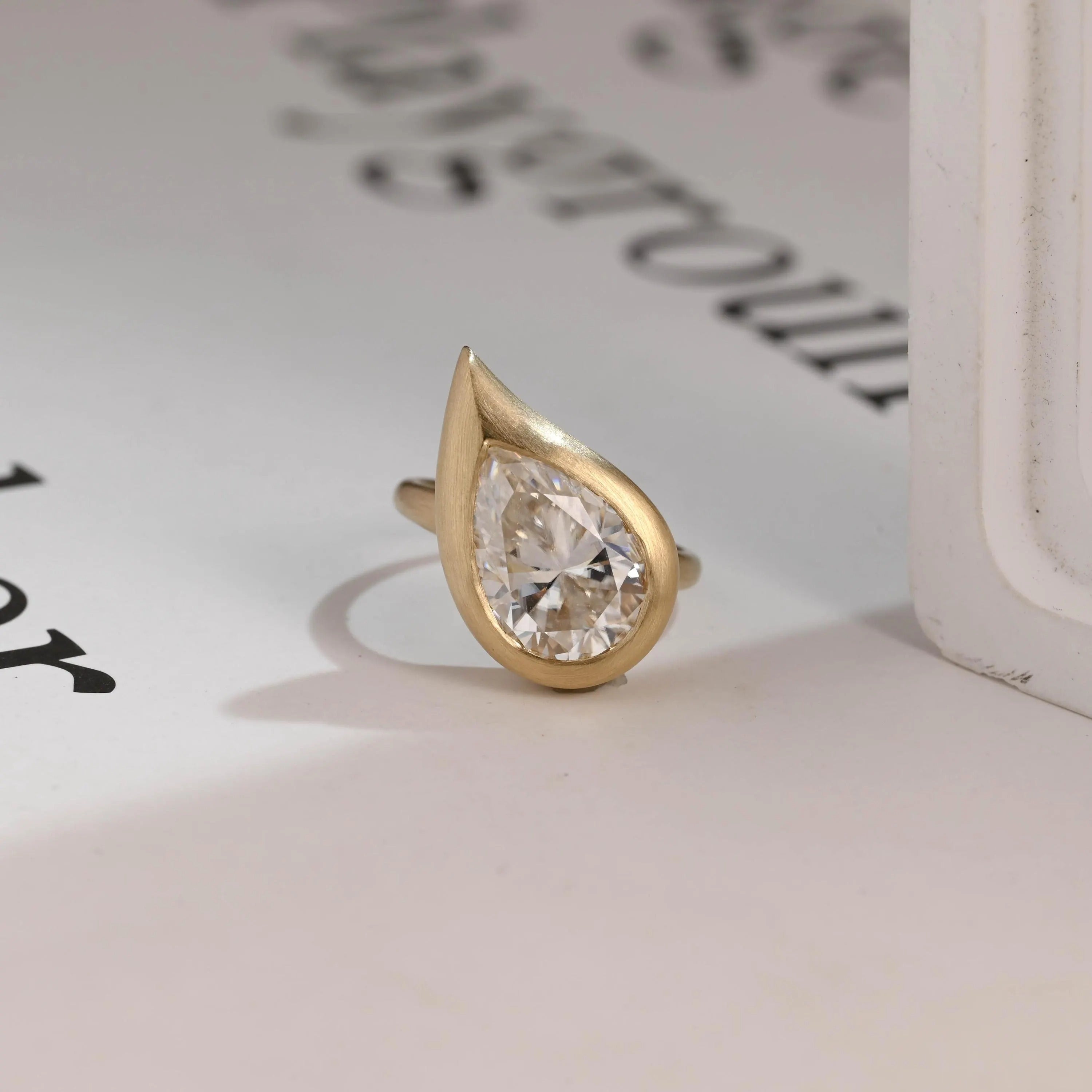 Solid Gold Pear Moissanite Engagement Ring, Bezel Set Brushed Finish Main image