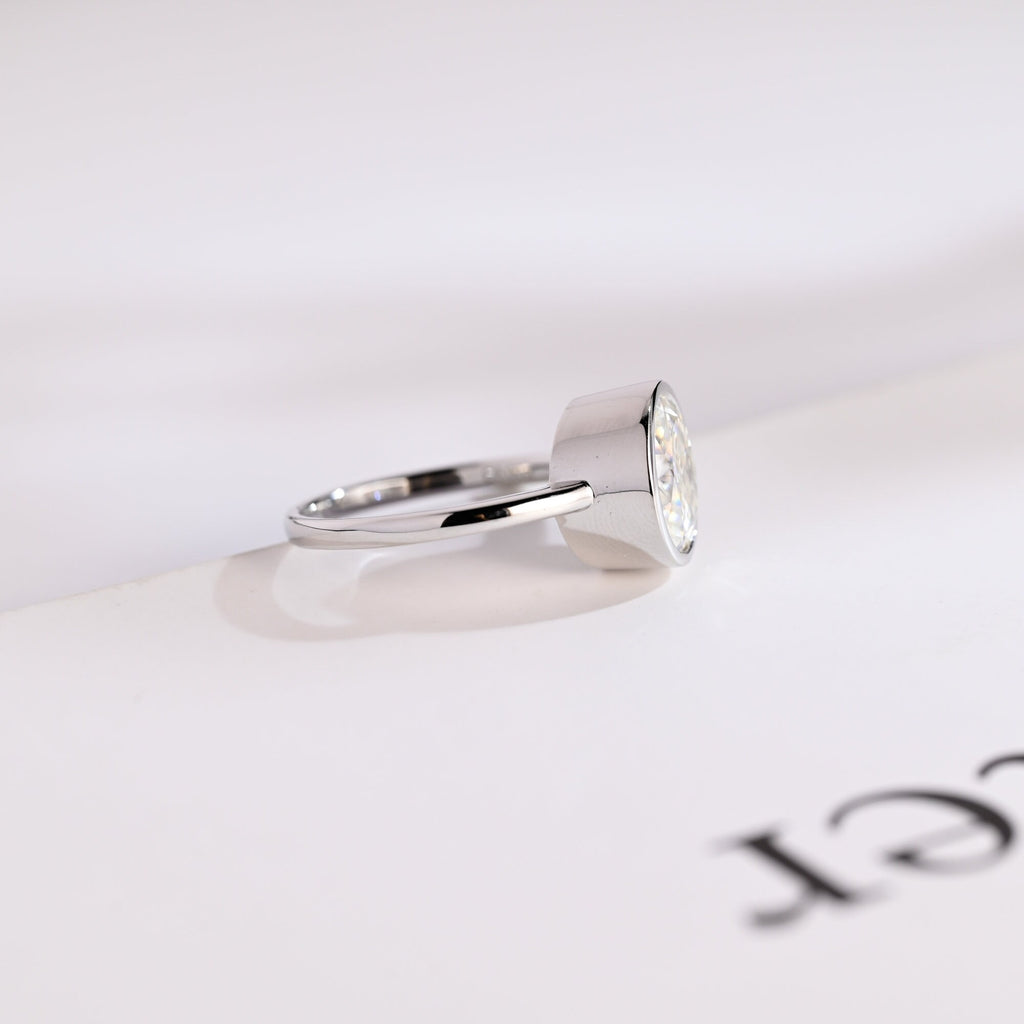 Solid Gold Oval Cut Crushed Ice Moissanite Engagement Ring with Bezel