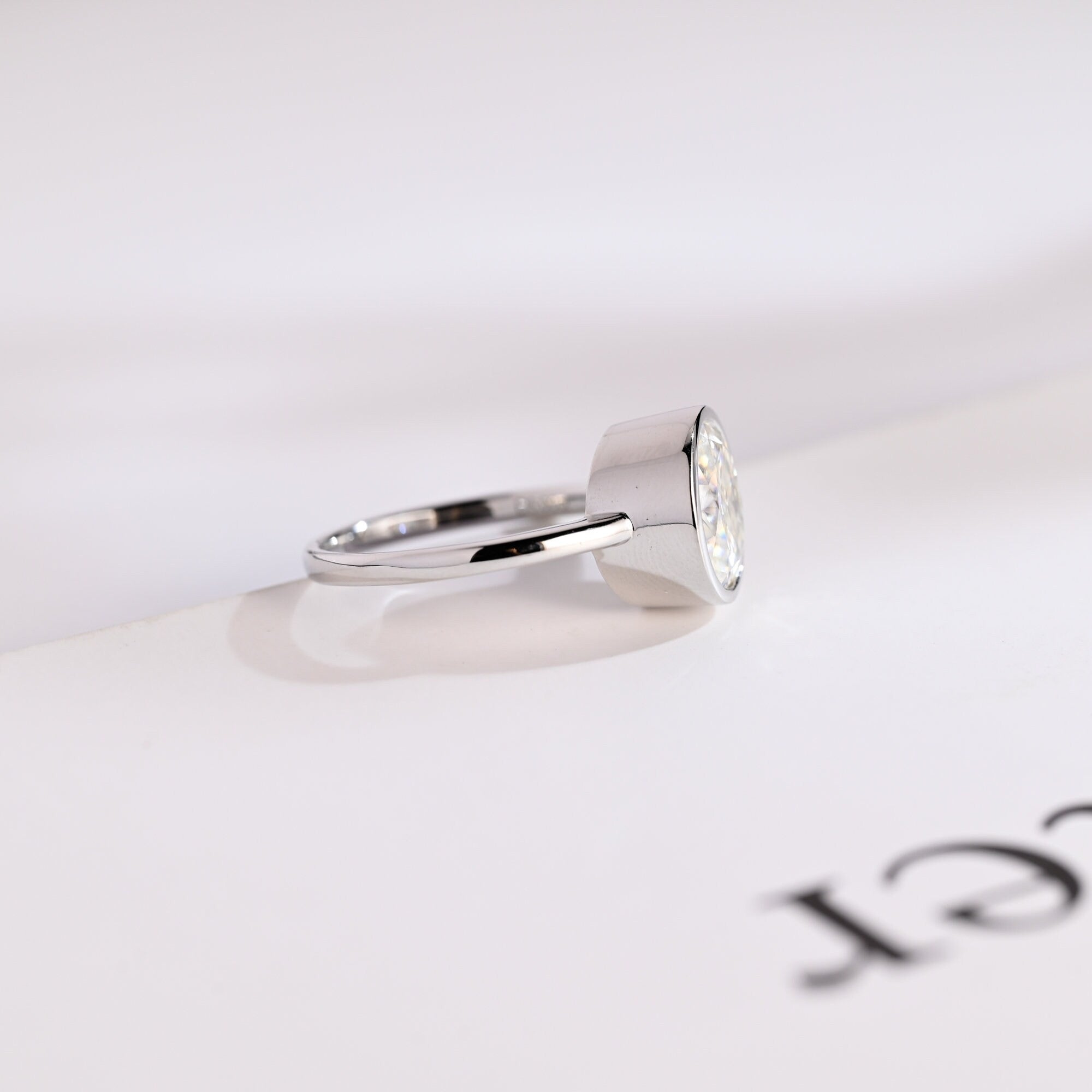 Solid Gold Oval Cut Crushed Ice Moissanite Engagement Ring with Bezel