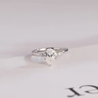 Solid Gold Pear Cut Moissanite Engagement Ring with Side Stone
