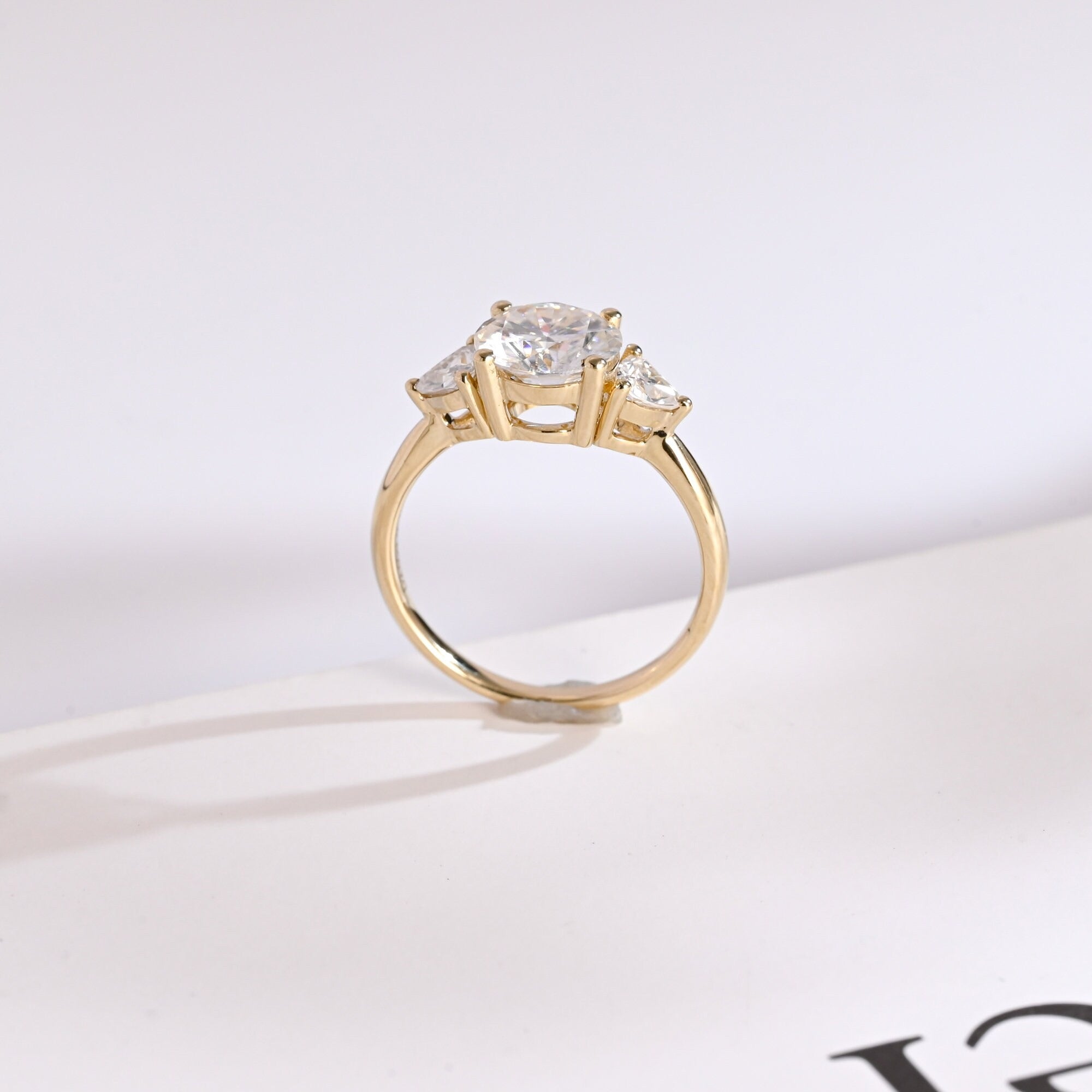 Solid Gold Three Stone Round Cut Moissanite Engagement Ring with Trillion Accent Secondary image