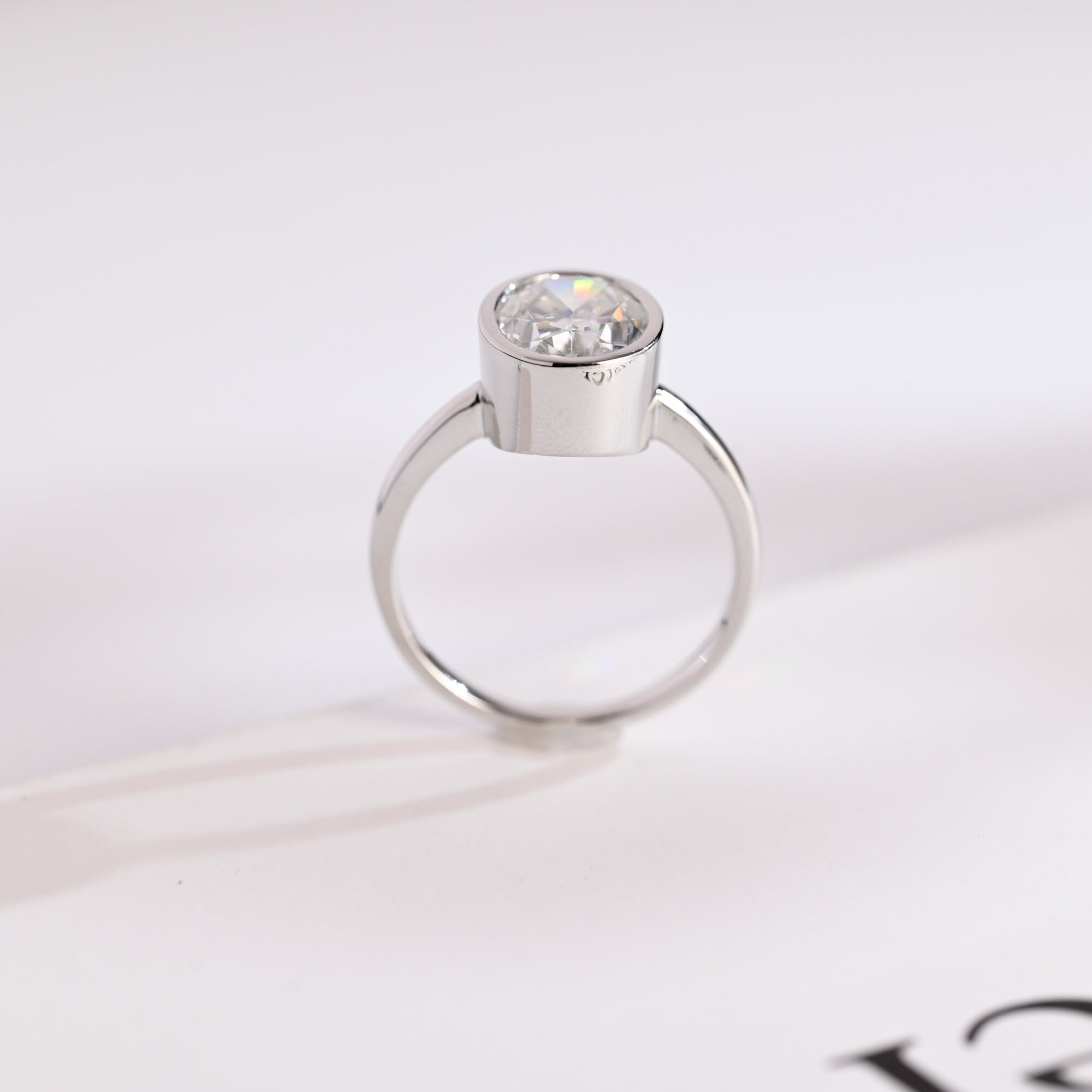 Solid Gold Oval Cut Crushed Ice Moissanite Engagement Ring with Bezel Secondary image