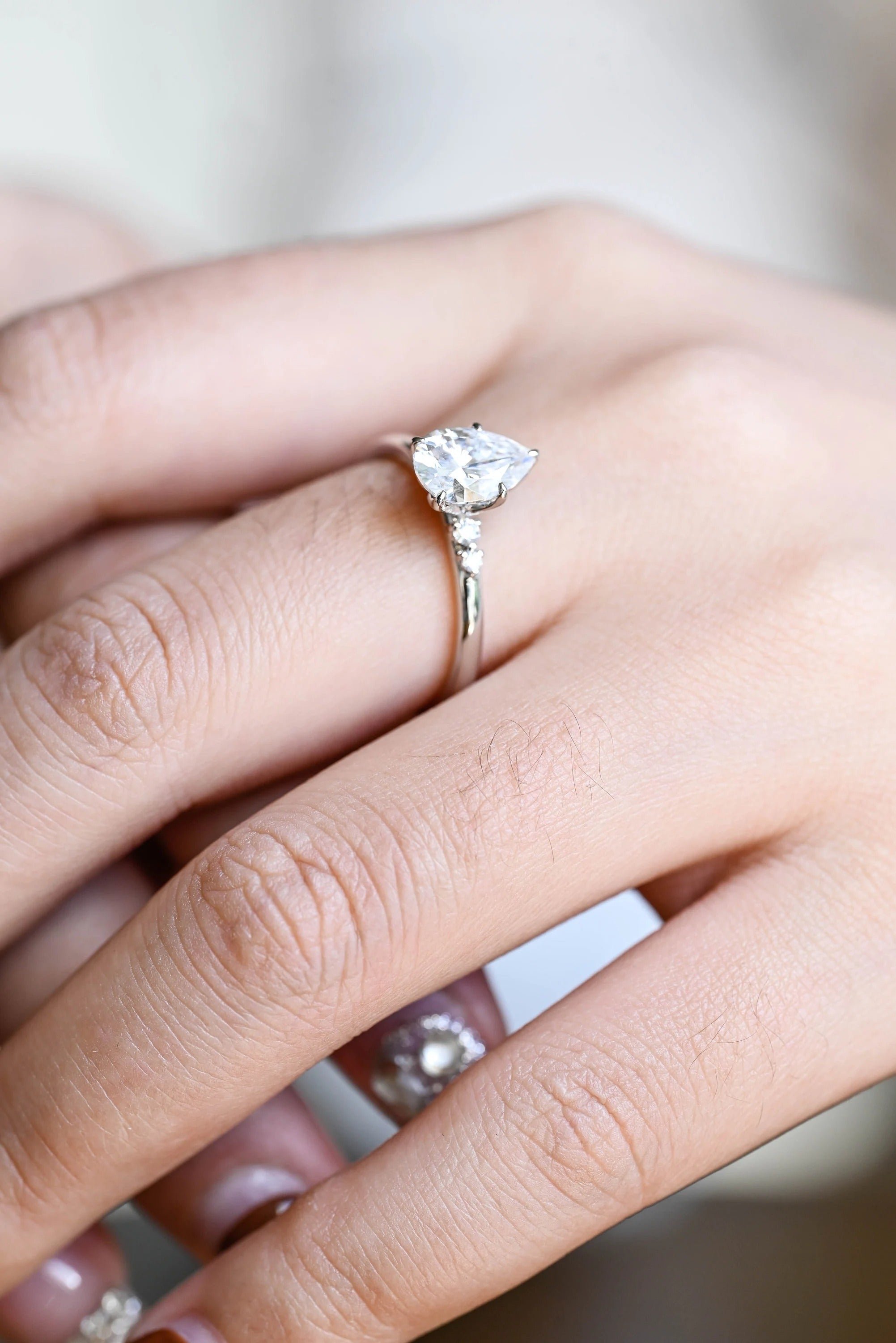 Solid Gold Pear Cut Moissanite Engagement Ring with Side Stone