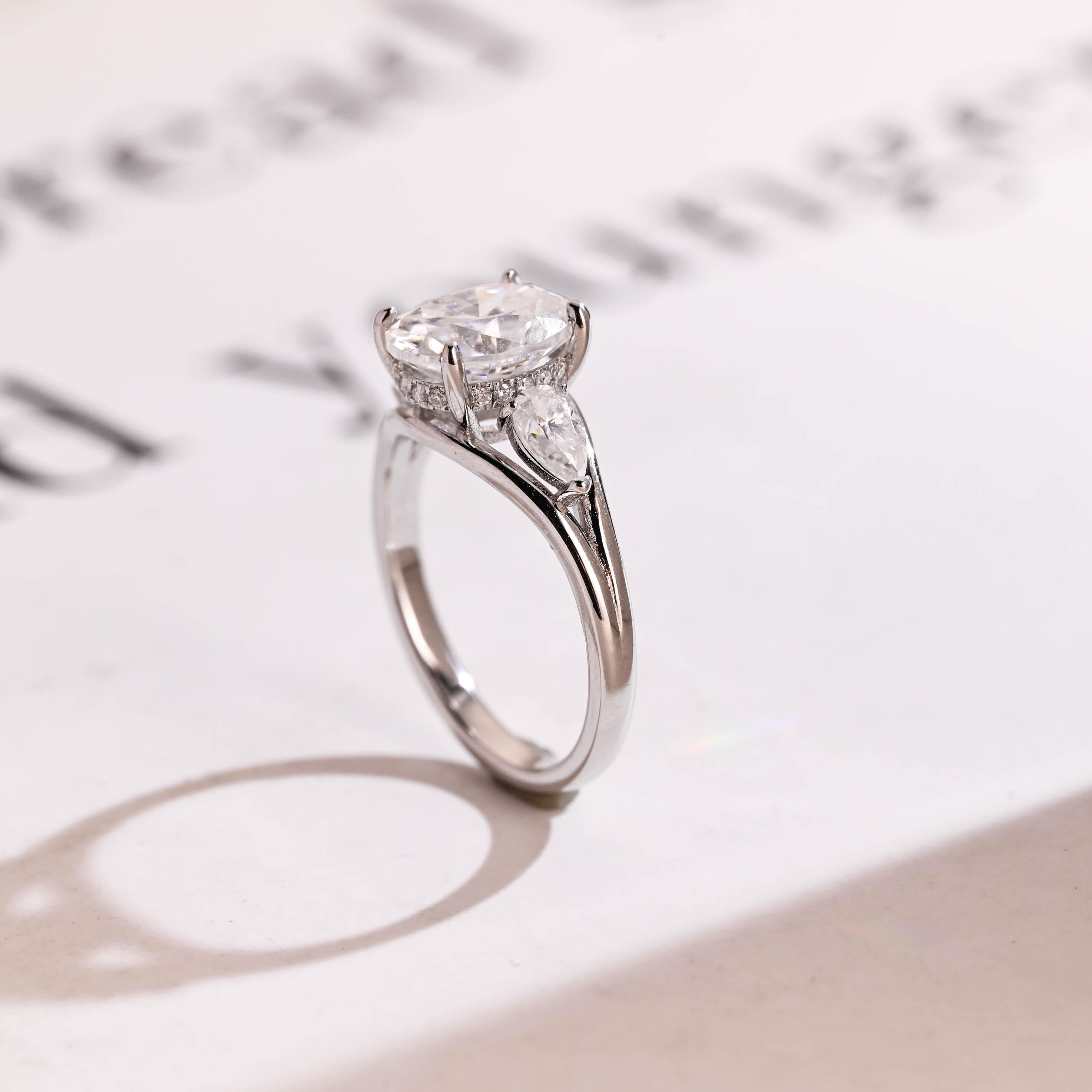 Solid Gold Oval Moissanite Hidden Halo Engagement Ring with Pear Moissanite Secondary image