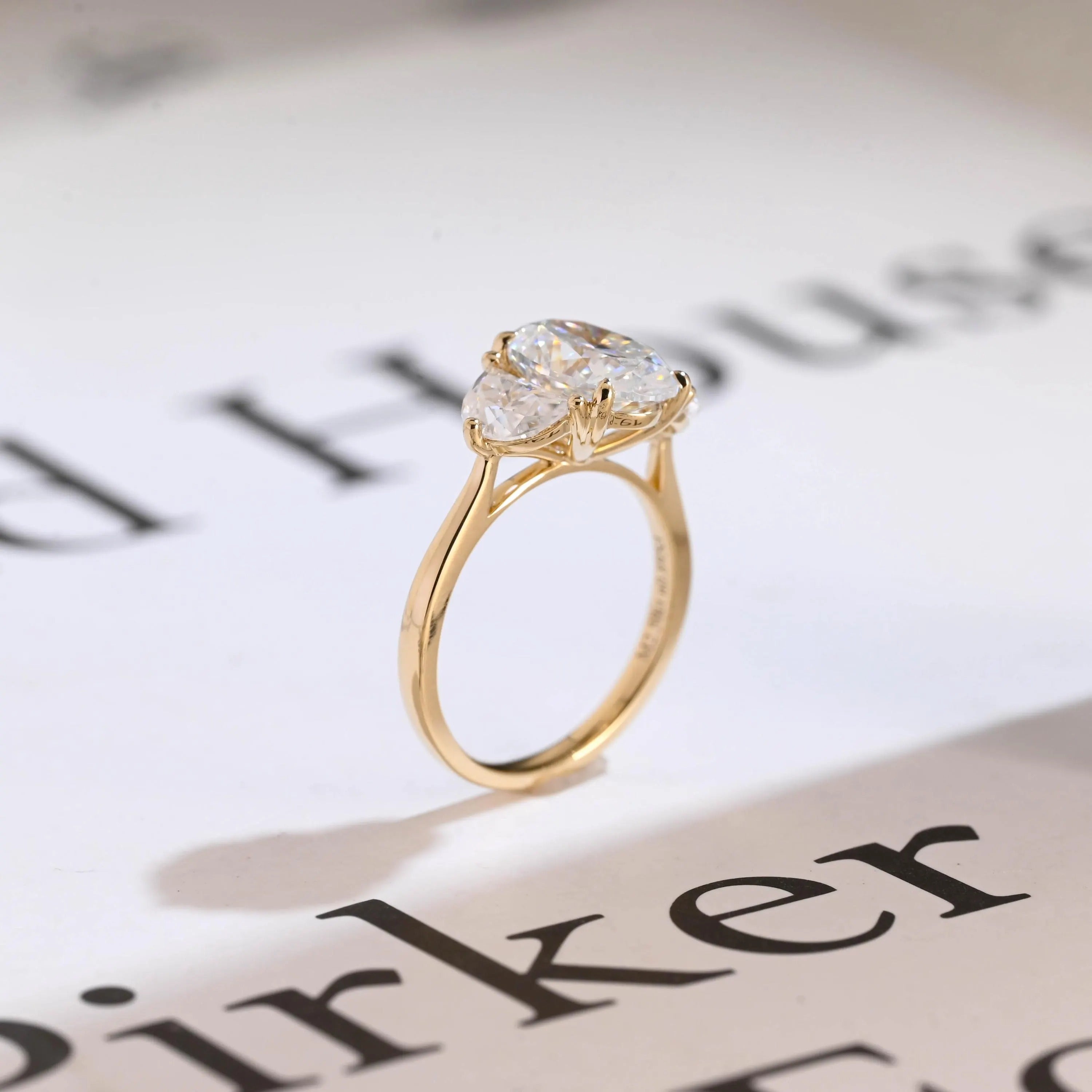 Solid Gold Oval Moissanite Engagement Ring with Half-moon Side Stones Secondary image