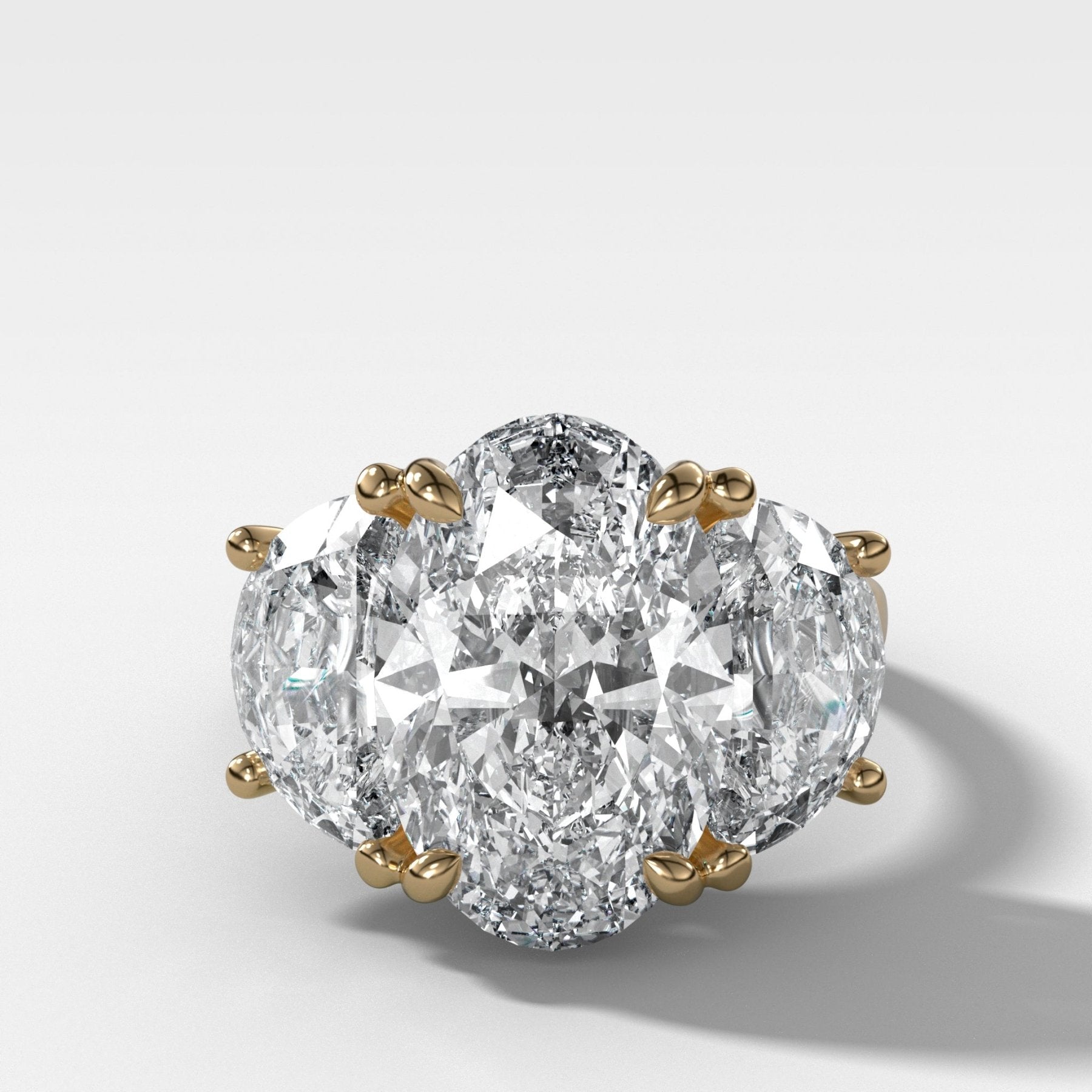Jumbo Three Stone ring with Half Moon sides & an Oval Cut
