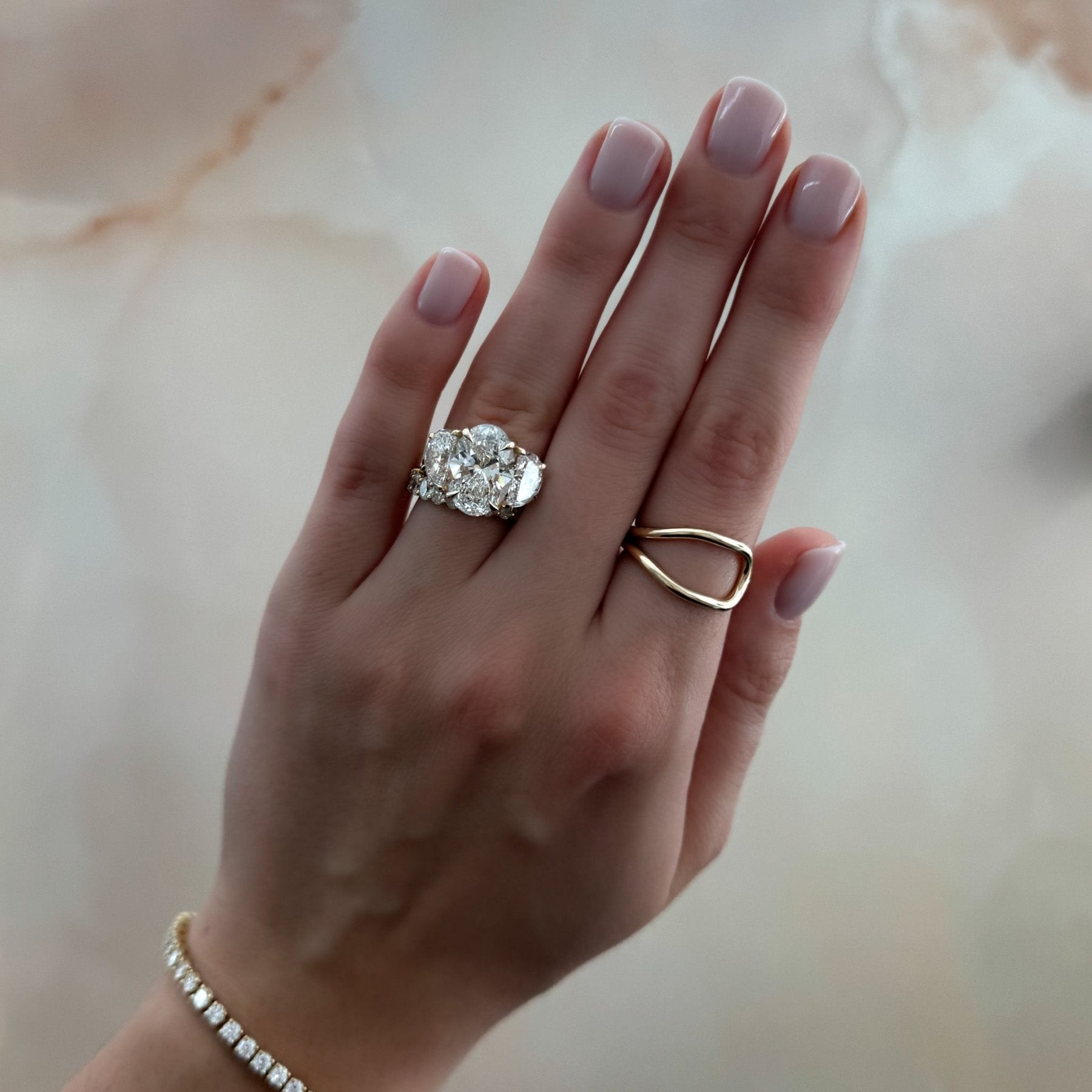 Jumbo Three Stone ring with Half Moon sides & an Oval Cut
