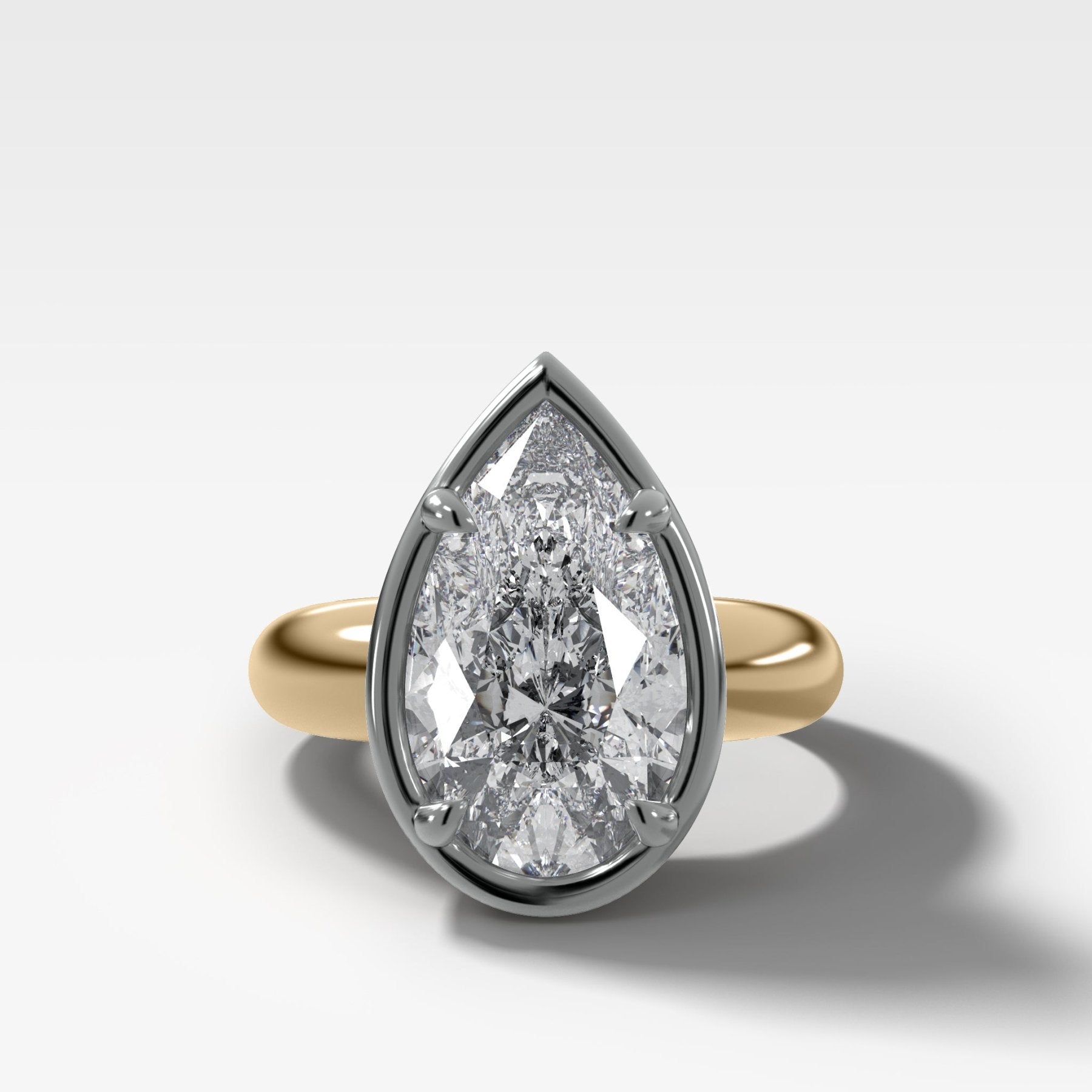 Mixed Metal Club Ring Solitaire Engagement Ring With a Pear Cut Diamond