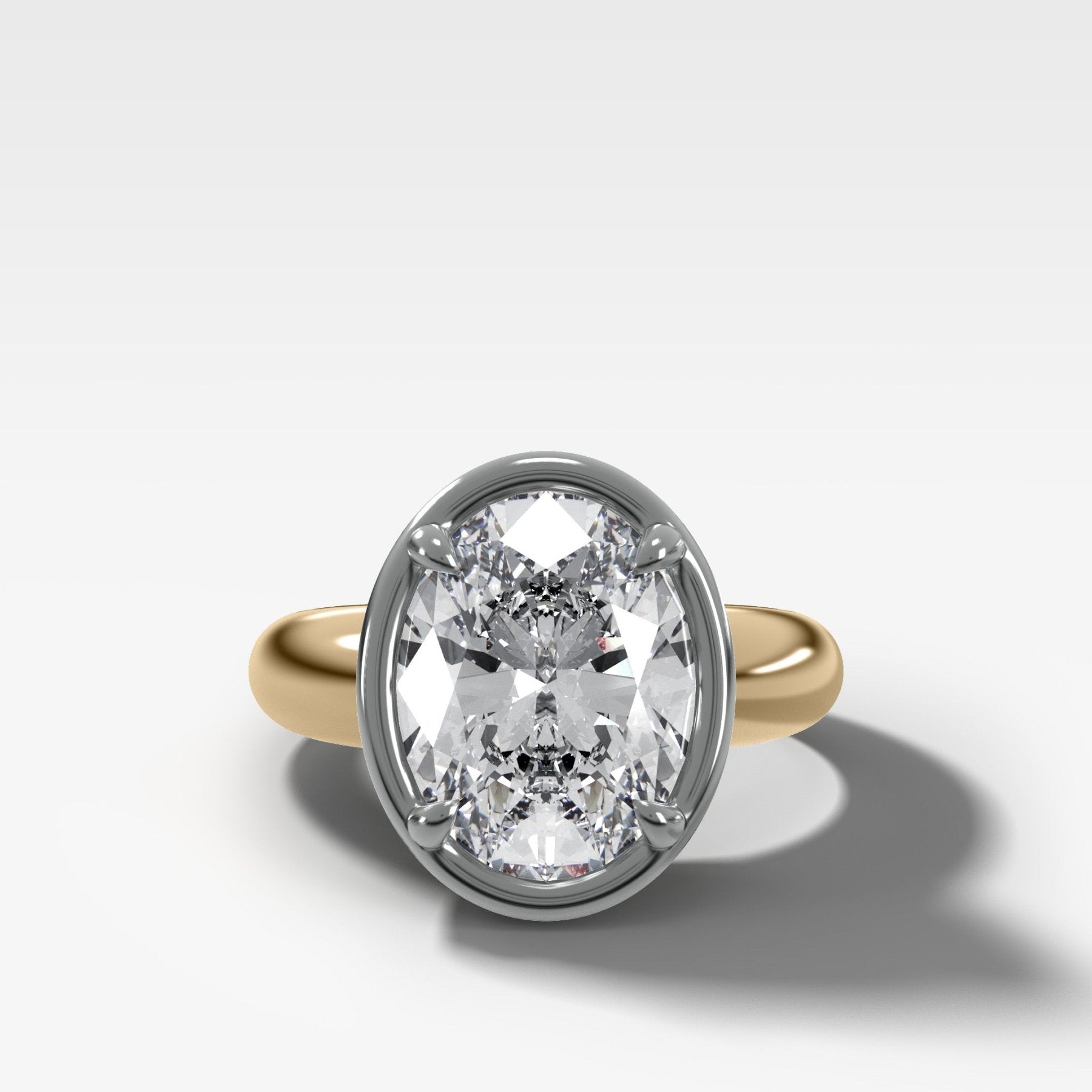 Mixed Metal Club Ring Solitaire Engagement Ring With an Oval Cut Diamond