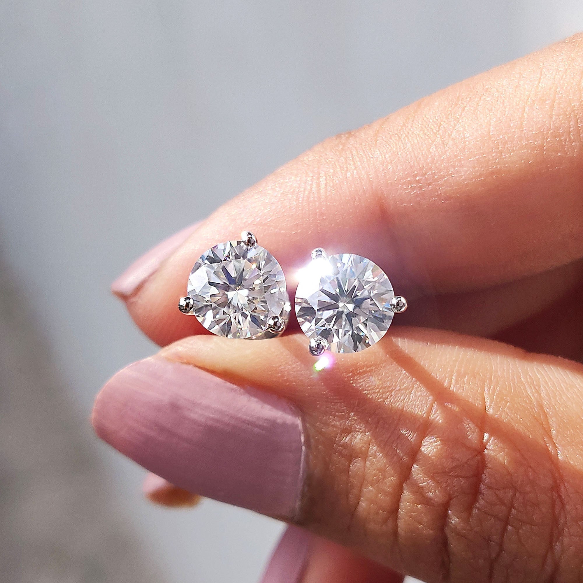 Round Cut Moissanite Earrings In Stud Style