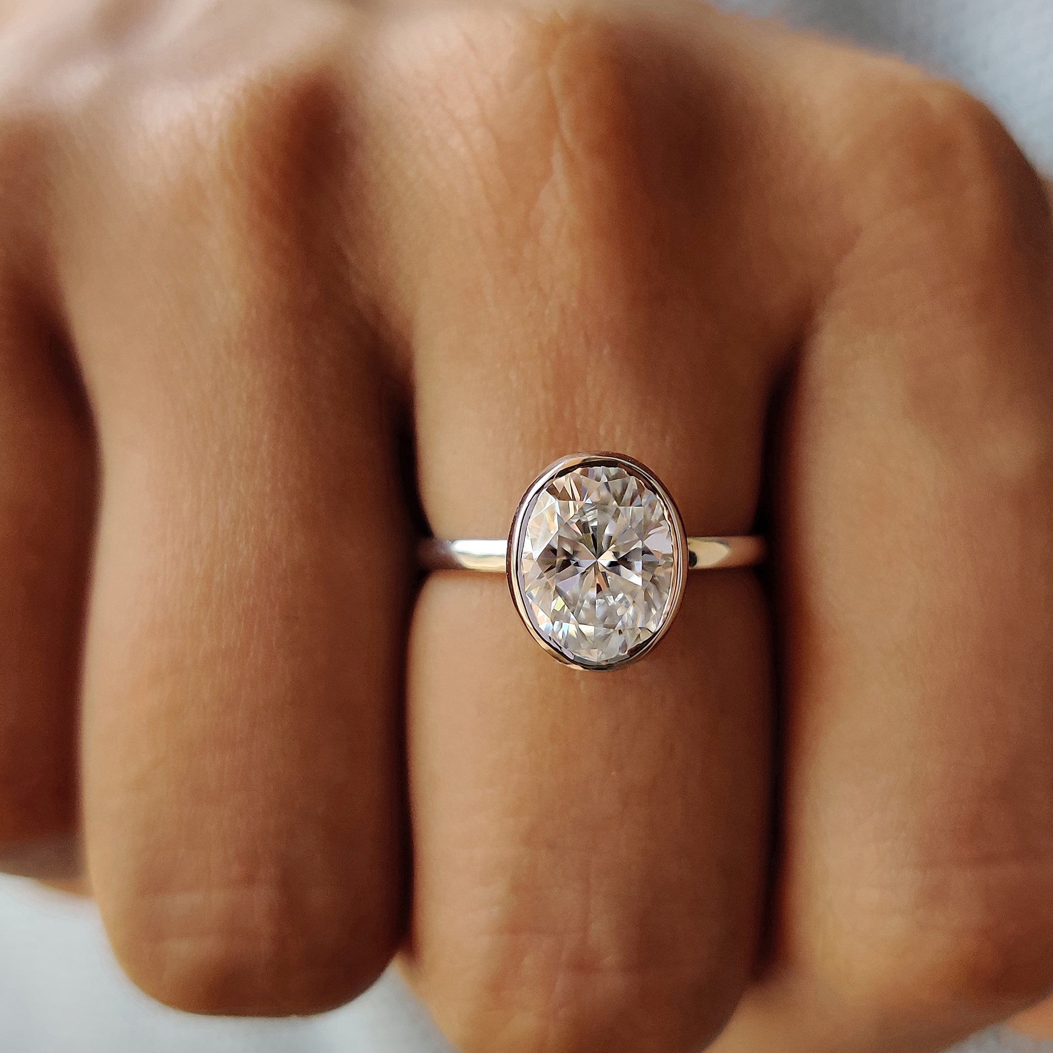 Oval Bezel Engagement Ring In Solitaire Style