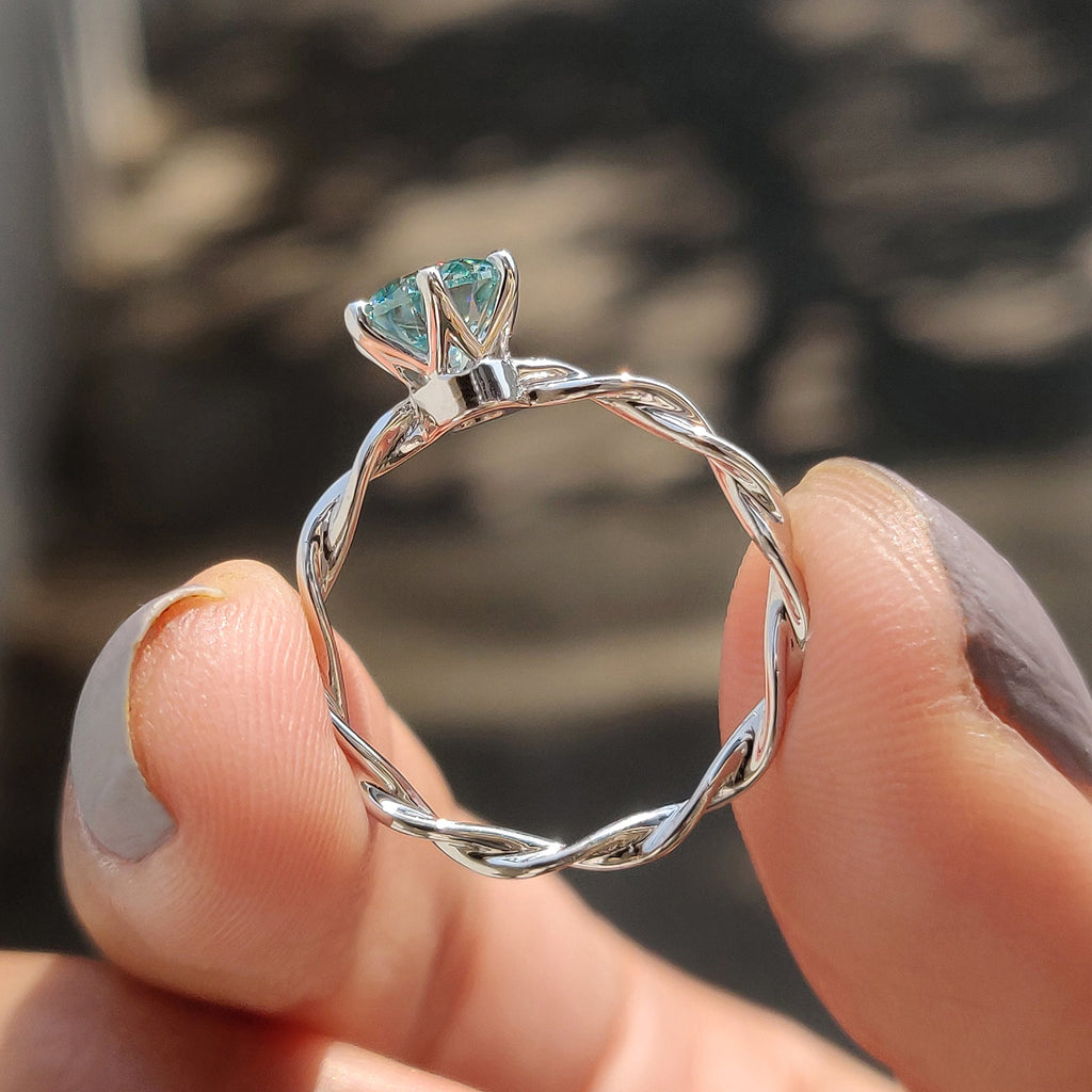 Round Solitaire Engagement Ring With Twisted Setting