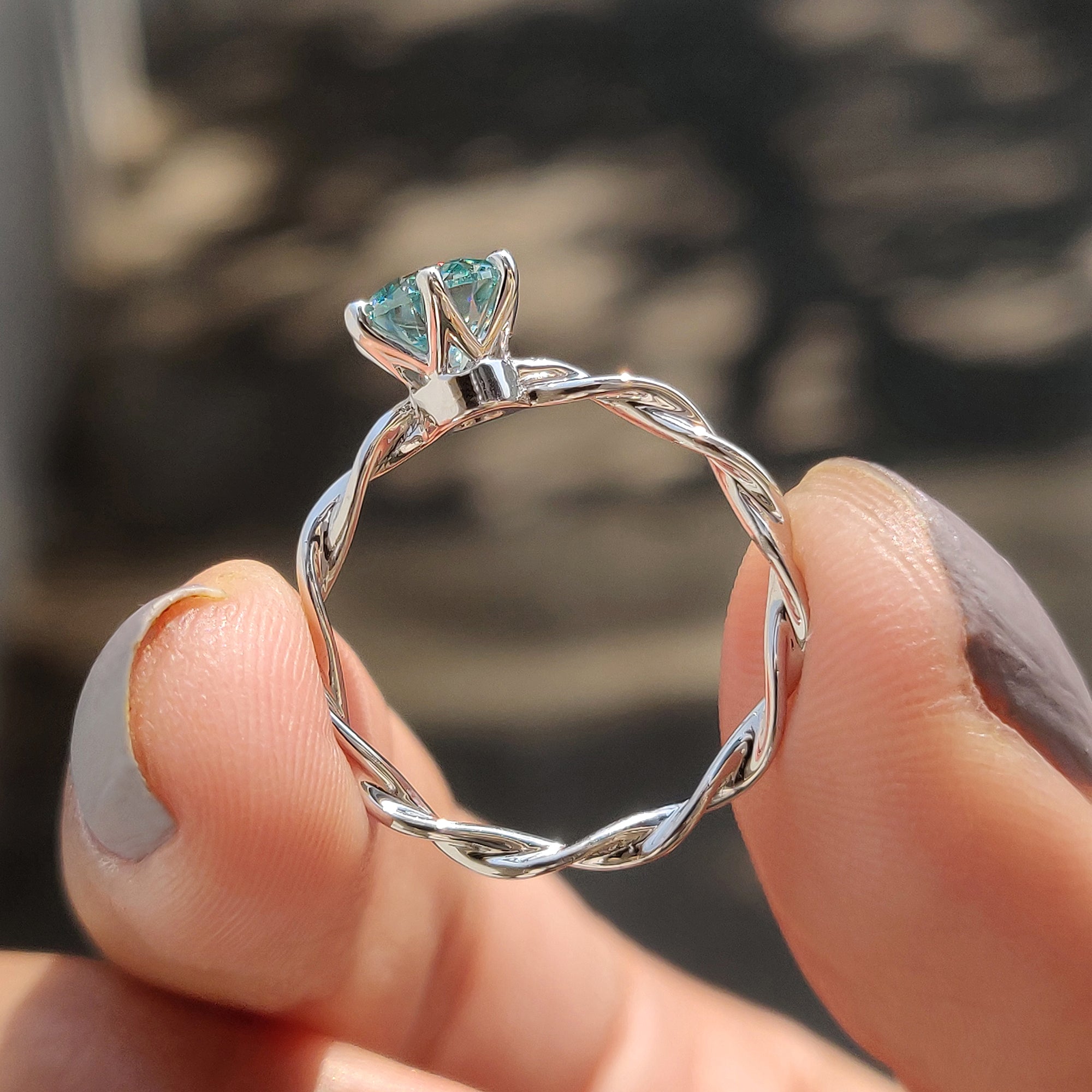 Round Solitaire Engagement Ring With Twisted Setting