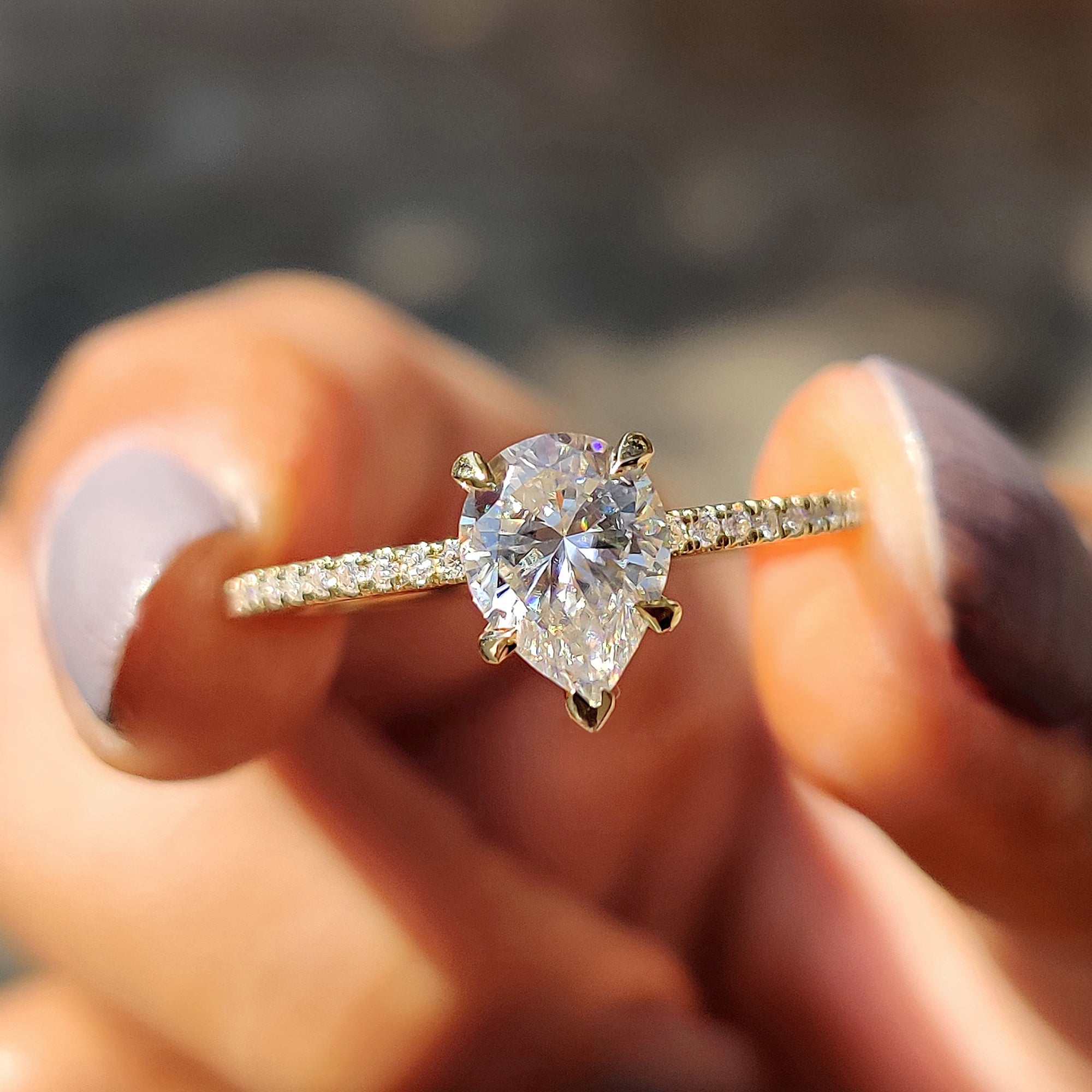 Pear Shaped Engagement Ring in Round Cut Pave Band