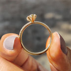 Pear Shaped Engagement Ring in Round Cut Pave Band