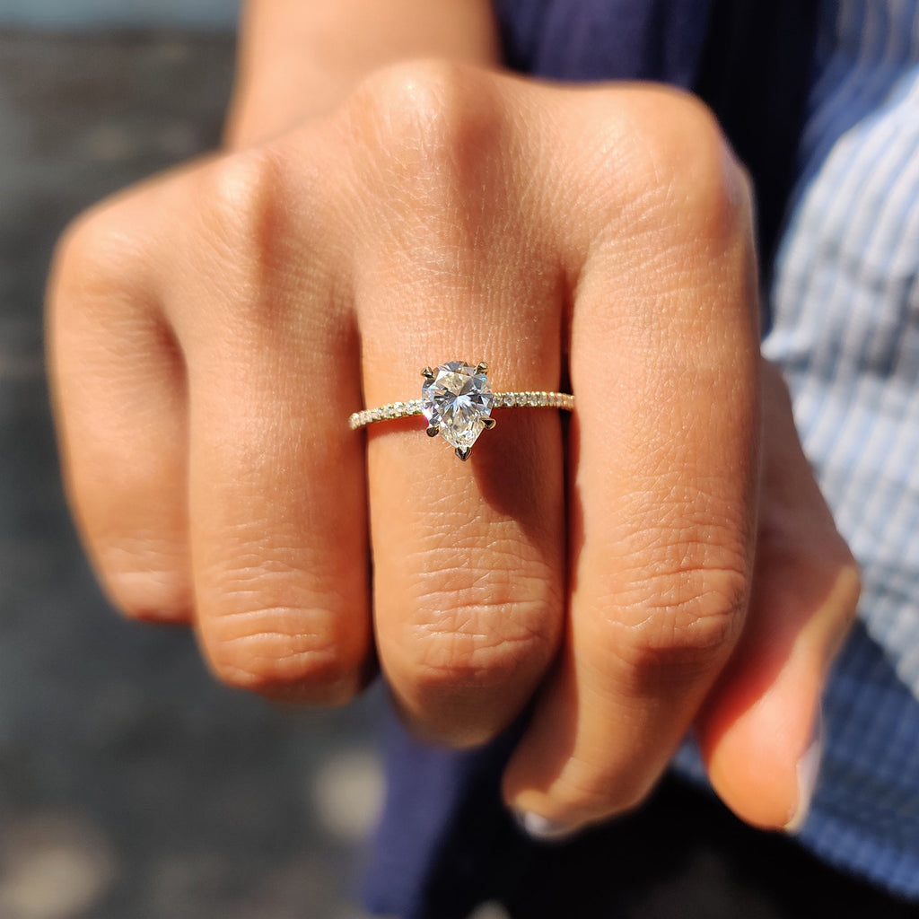 Pear Shaped Engagement Ring in Round Cut Pave Band